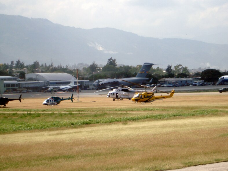 The parking ramp at the Port-Au-Prince, Haiti airport is filled to capacity with every type of transport aircraft from small piston-powered civilian airplanes to C-17s, Japanese C-130s, large commercial air carriers, and United Nations helicopters.U.S.Air Force Photo by Capt. Greg Le Crone