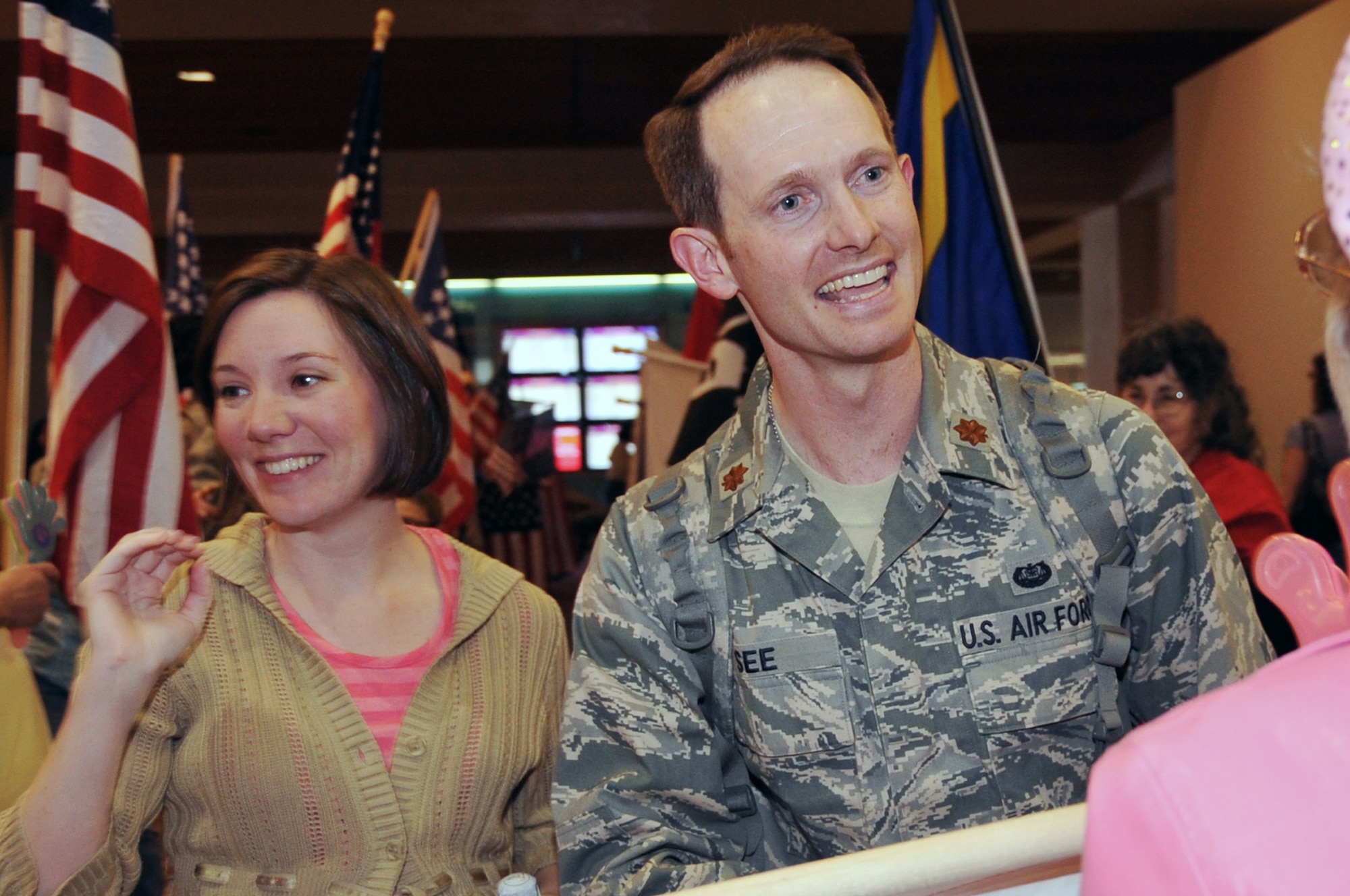 Maj. Stephen See, Air Force Nuclear Weapons Center Judge Advocate, and wife Ashley See were greeted by the Blue Star Mothers and Airmen from Kirtland AFB, March 18. Major See returned from deployment with the good news that he will soon be a father and is a lieutenant colonel select.

U.S. Air Force Photo by Elizabeth Martinez