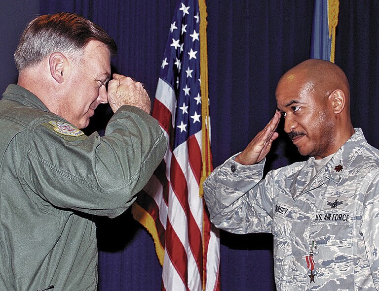 Maj. Hamilton L. Dorsey, Air Force Operational Test and Evaluation Center, received the Bronze Star Medal from Maj. Gen. Stephen T. Sargeant, AFOTEC commander, during a Feb. 5 commander?s call. Major Dorsey received the award for exceptionally meritorious achievement during a 12-month deployment to Baghdad, Iraq. According to the citation, his hard work and due diligence resulted in a $984 million foreign military sales case for the C-130J heavy lift transport aircraft, ensuring future delivery of six state of the art aircraft with sustainment for the Iraqi air force. The Bronze Star is awarded to personnel in any branch of the military service who distinguished themselves by heroic or meritorious achievement or service, not involving participation in aerial flight, in connection with military operations against an armed enemy.U.S Air Force Photo by George Diamond