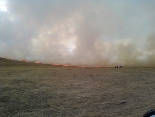 A brushfire blazes two miles southwest of the base March 31. The Warren Fire Department, Laramie County Fire Districts 1,2,8 and 10, as well as the Wyoming Air National Guard responded to the incident. (U.S. Air Force photo)