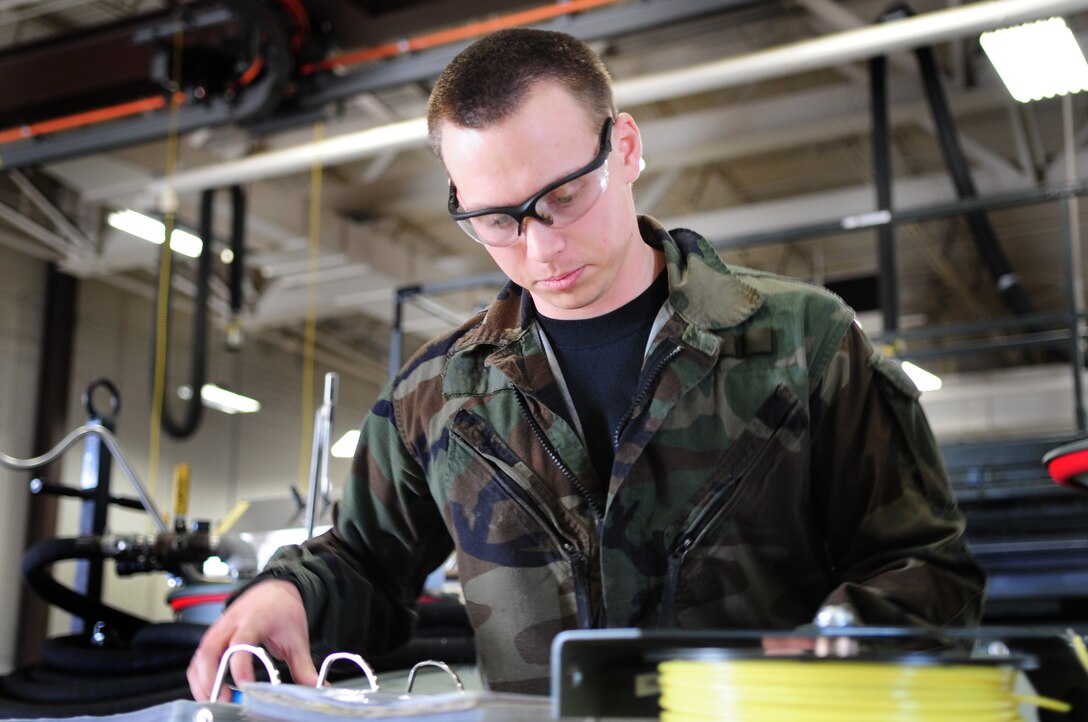 ELLSWORTH AIR FORCE BASE, S.D. -- Senior Airmen David Carter, 28th Maintenance Squadron aerospace ground equipment journeyman, looks over a technical order, March 31.  In the maintenance career field, the use of TO's ensures Airmen follow correct procedures. (U.S. Air Force photo/Airman 1st Class Anthony Sanchelli)