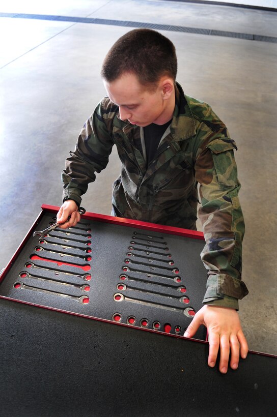 ELLSWORTH AIR FORCE BASE, S.D. -- Senior Airmen David Carter, 28th Maintenance Squadron aerospace ground equipment journeyman, takes a 9mm wrench from a tool box, March 31.  As part of his daily assigned duties, Airman Carter maintains a vast array of equipment used out on the flightline. (U.S. Air Force photo/Airman 1st Class Anthony Sanchelli)