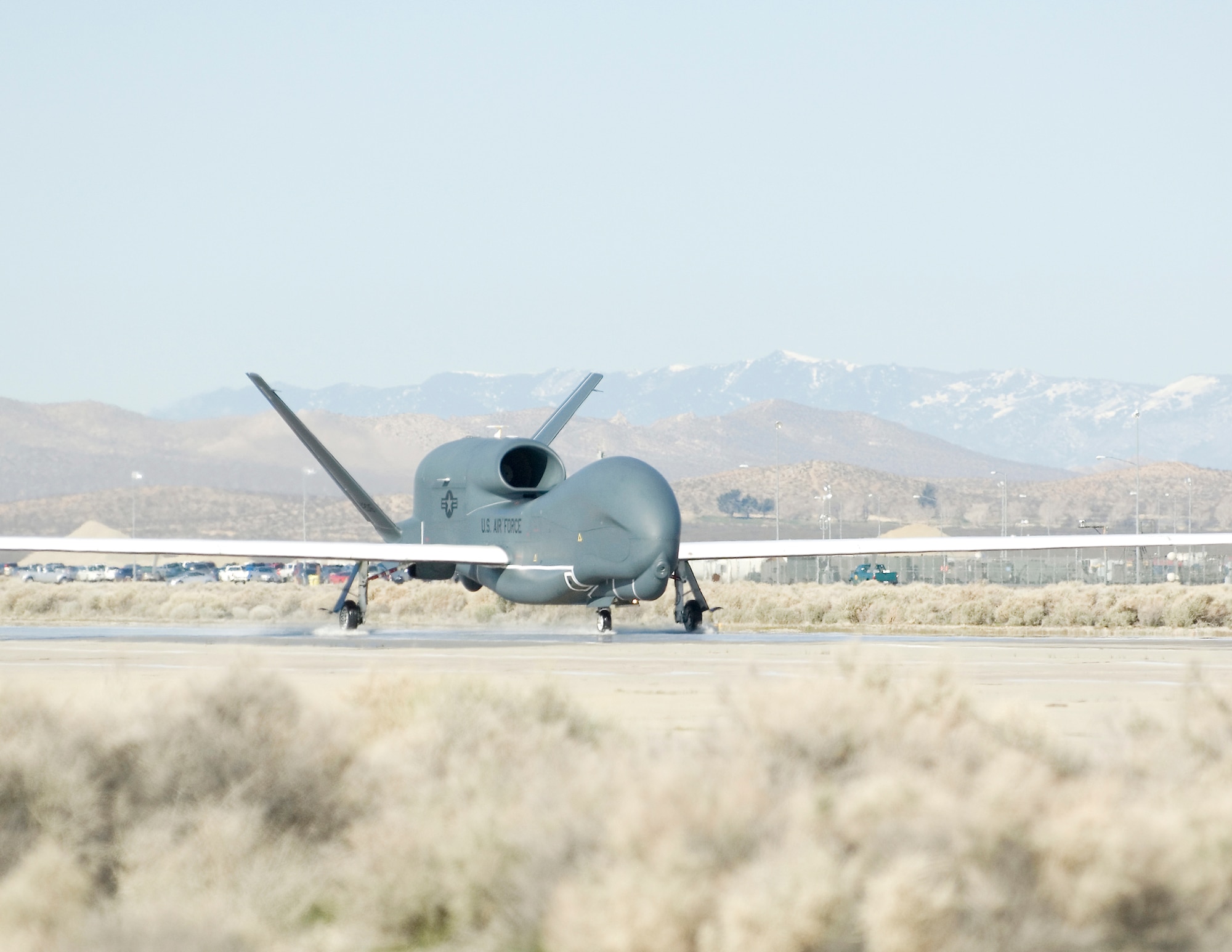 A RQ-4 Global Hawk completes a wet runway test March 12, 2010, at Edwards Air Force Base, Calif. Members of the 452nd Flight Test Squadron will wrap up its Block 20 wet runway testing around the beginning of April. (Courtesy photo)