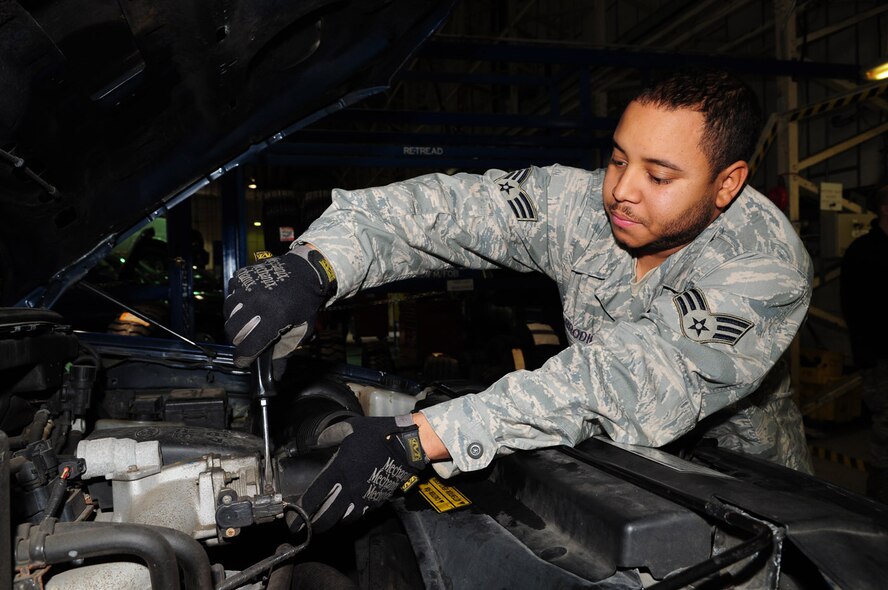 Senior Airman Darryl Brodie, a reservist from the 459th Logistics Readiness Flight at Andrews Air Force Base, Washington D.C., replaces a power steering pump on a government pick-up truck March 25 in the 100th Logistics Readiness Squadron Vehicle Maintenance warehouse. Airman Brodie was one of several reservists TDY to RAF Mildenhall for annual training. (U.S. Air Force photo/Karen Abeyasekere)