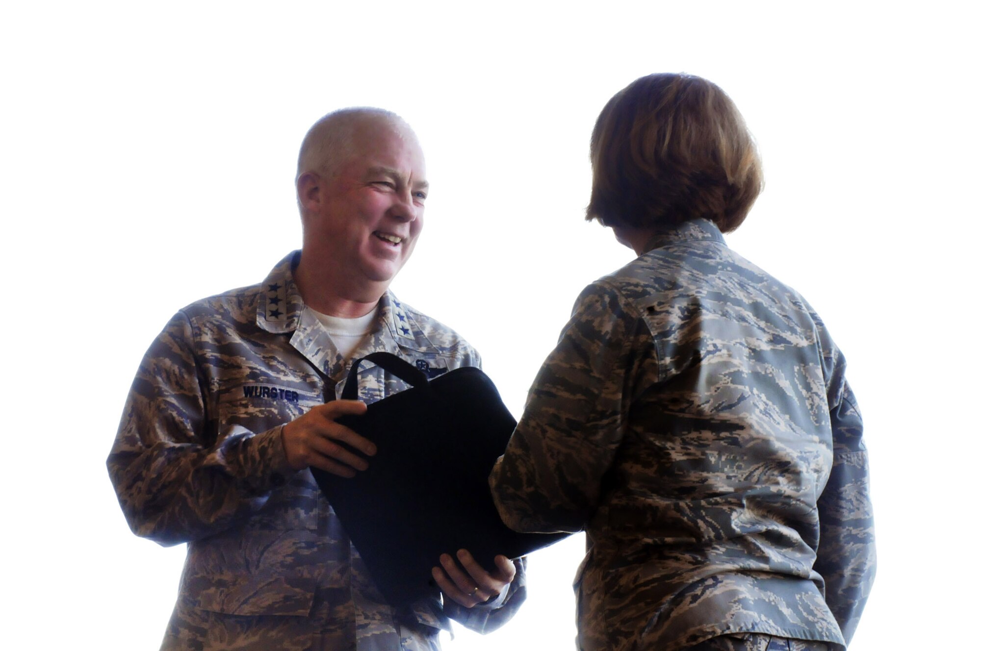 Lt. General Donald Wurster accepts the aircraft forms for the MC-130W from Maj. Gen Polly Peyer. U. S. Air Force photo by Sue Sapp