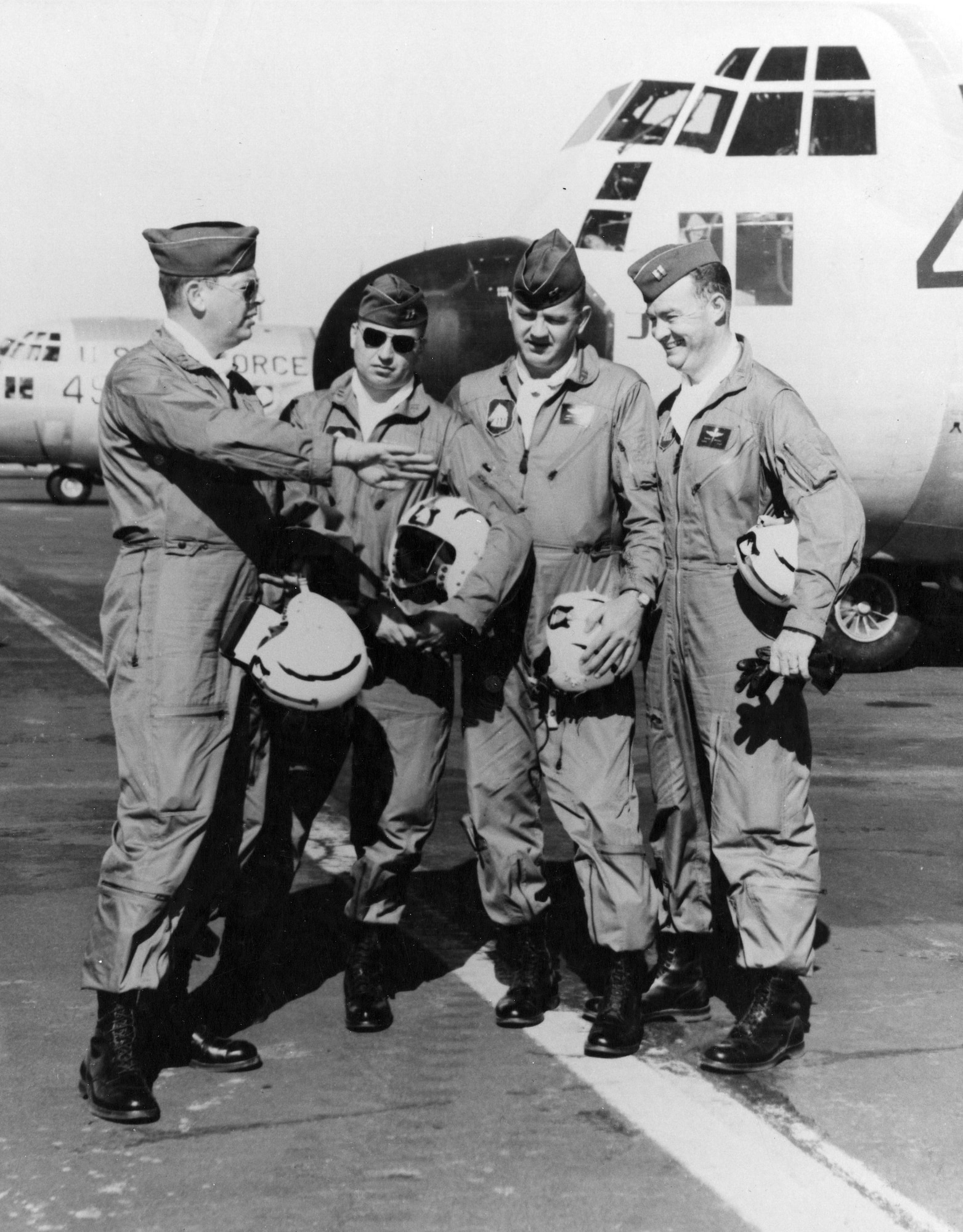The original Four Horsemen, Gene Chaney, James Akin, David Moore and Bill Hatfield have a conversation amongst themselves in front of a C-130. The Four Horsemen are a C-130 demonstration team that came together in 1957. (Courtesy photo)