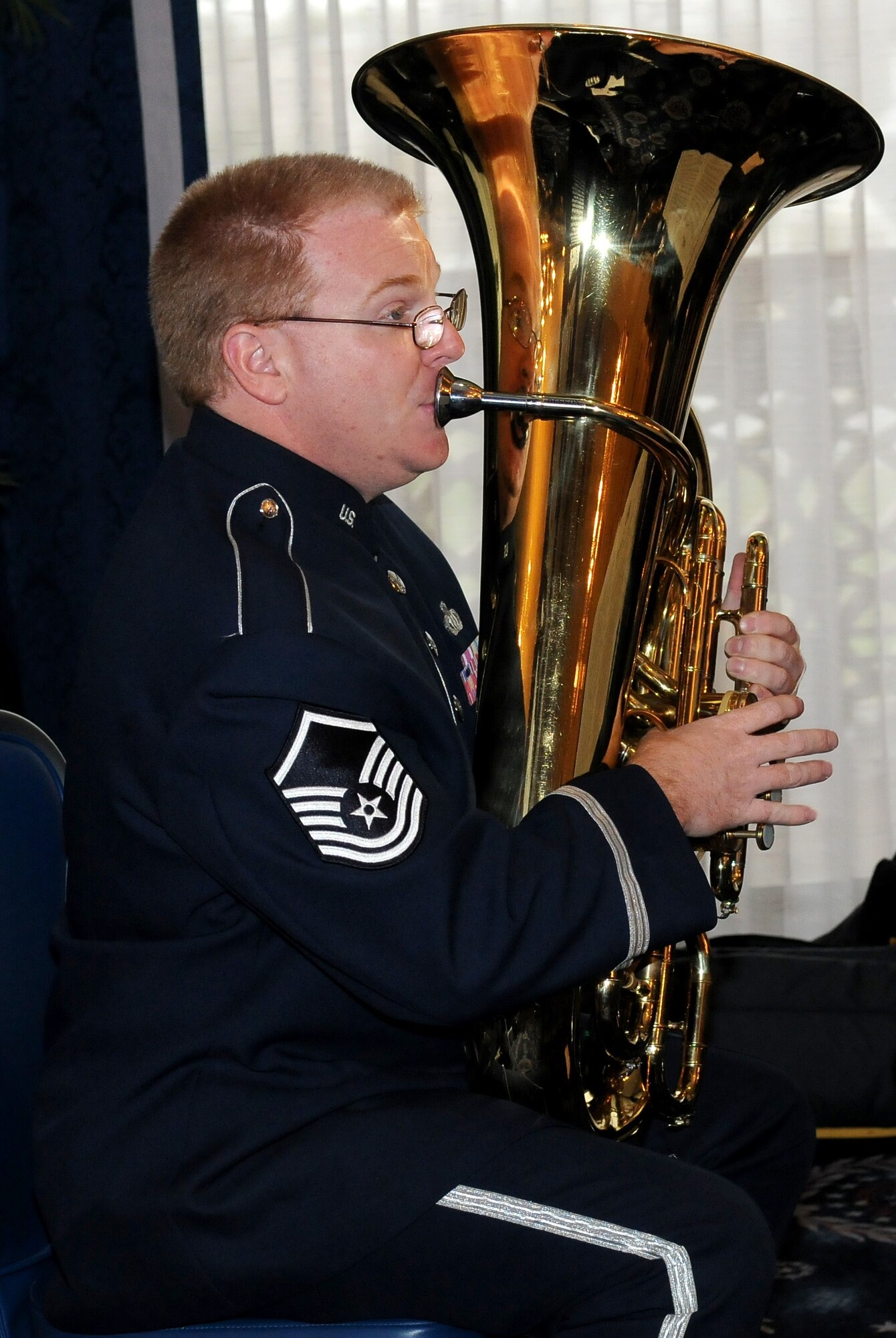 Master Sgt. Christopher Quade plays the tuba during the Conseil International du Sport Militaire March 28 at the Bolling Club. CISM was founded Feb. 18, 1948 with Belgium, Denmark, France and Luxembourg and the Netherlands representatives signing the original charter. Many organizations from Bolling supported the week-long conference that involved leaders representing 17 countries. (U.S. Air Force photo by Airman 1st Class Katherine Windish)