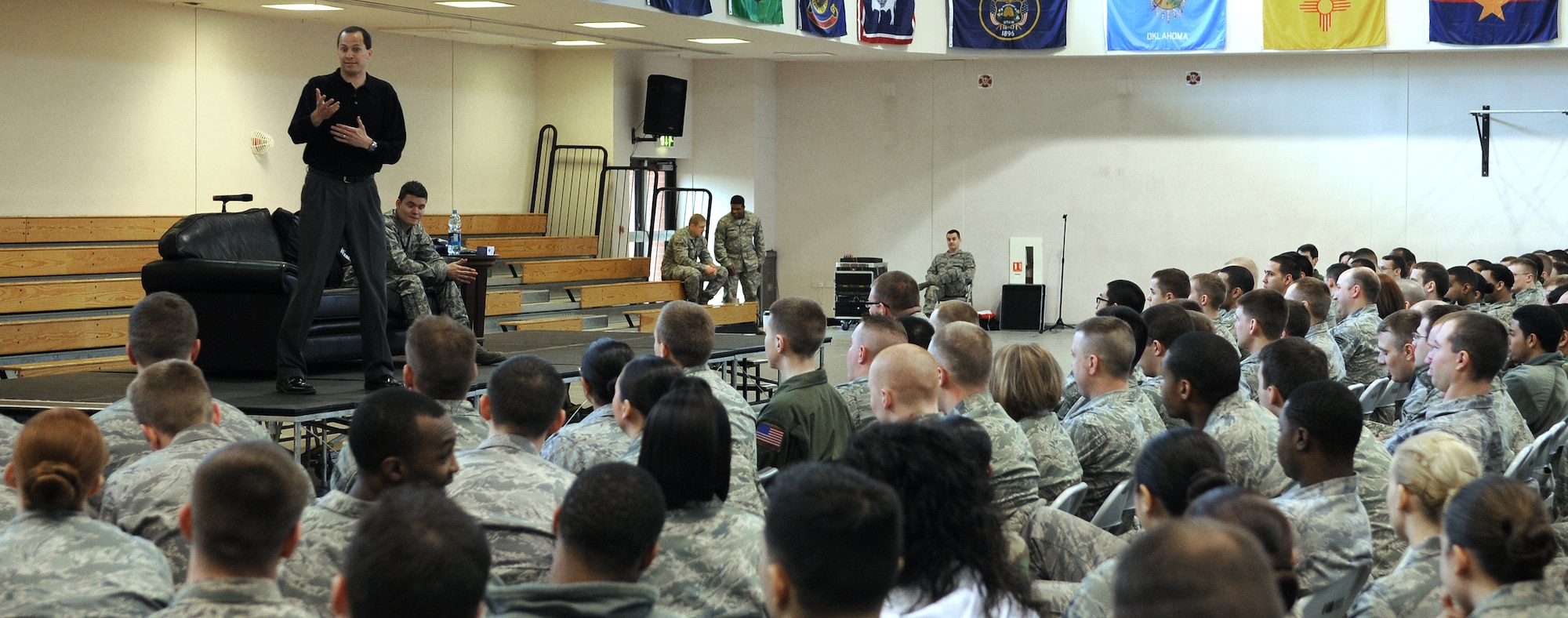 RAF MILDENHALL, England -- Mike Domitrz, a motivational speaker, speaks to Airmen at the Hardstand Fitness Center here on the importance of respect and communication in a relationship March 31. The briefing was arranged to resemble a combination of a play and seminar for Sexual Assault Awareness Month, which is observed in April. (U.S. Air Force photo/Staff Sgt. Thomas Trower) 