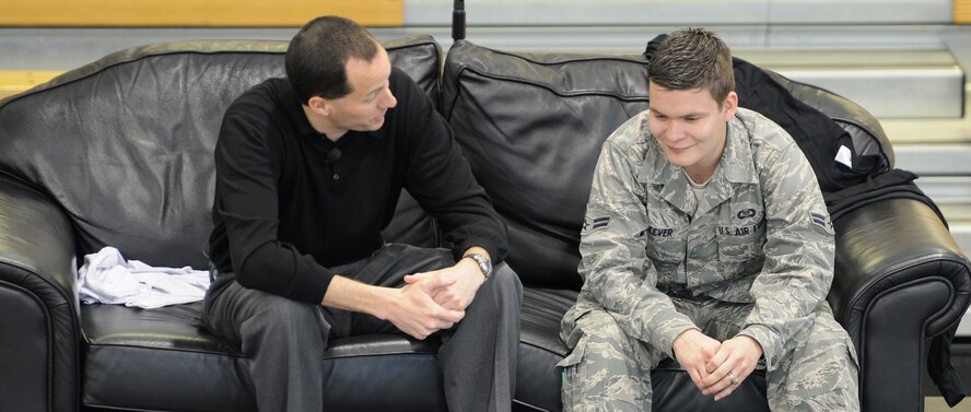 RAF MILDENHALL, England -- Mike Domitrz, a motivational speaker, and Airman 1st Class James Seever, 100th Operations Support Squadron, act out a dating scenario to demonstrate proper dating behavior at the Hardstand Fitness Center here March 31. This "Can I Kiss You?" program is organized by Mr. Domitrz to teach the importance of respect and communication in a relationship. It is one tool the RAF Mildenhall Sexual Assault Prevention and Response Office is using to highlight Sexual Assault Awareness Month, which is observed in April. (U.S. Air Force photo/Staff Sgt. Thomas Trower) 