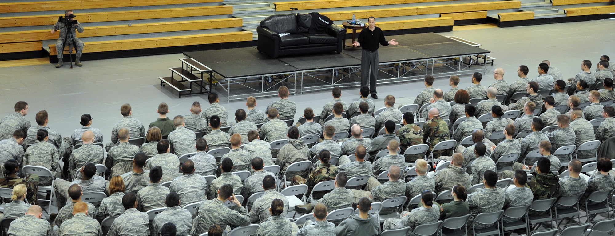 RAF MILDENHALL, England -- Mike Domitrz, a motivational speaker, speaks to Airmen at the Hardstand Fitness Center here on the importance of respect and communication in a relationship March 31. The briefing was arranged to resemble a combination of a play and seminar for Sexual Assault Awareness Month, which is observed in April. (U.S. Air Force photo/Staff Sgt. Thomas Trower) 