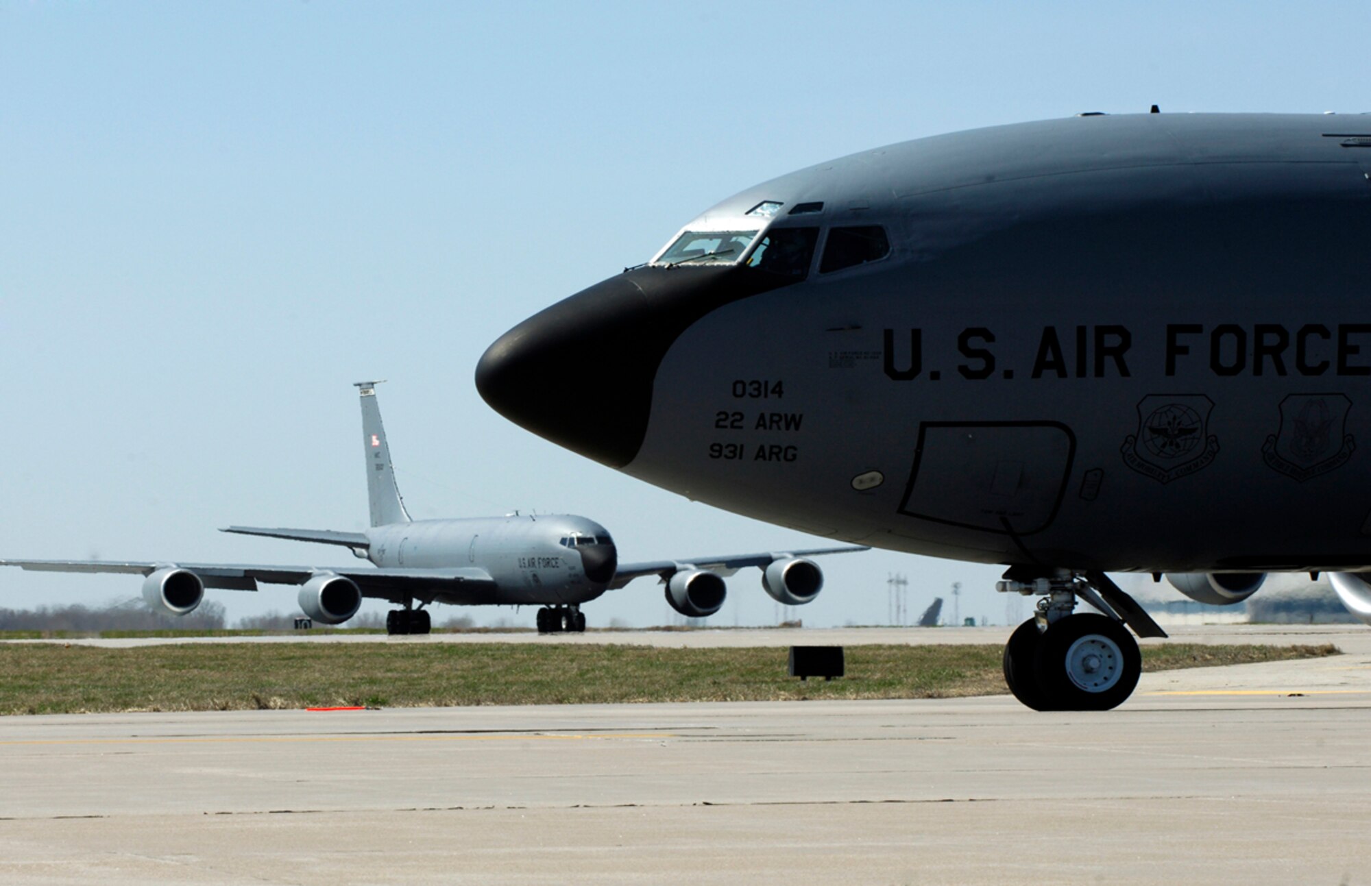 Two of McConnell’s 63 KC-135 Stratotankers taxi down a runway in preparation for a 12 aircraft “elephant walk” formation during the Nuclear Operational Response Exercise March 31, 2010, McConnell Air Force Base, Kan. The NORE showcased the McConnell Air Force Base aircrews’ capability to prepare a flight and take off within minutes of being notified of a mission. (U.S. Air Force photo/Airman 1st Class Andrea Salazar)