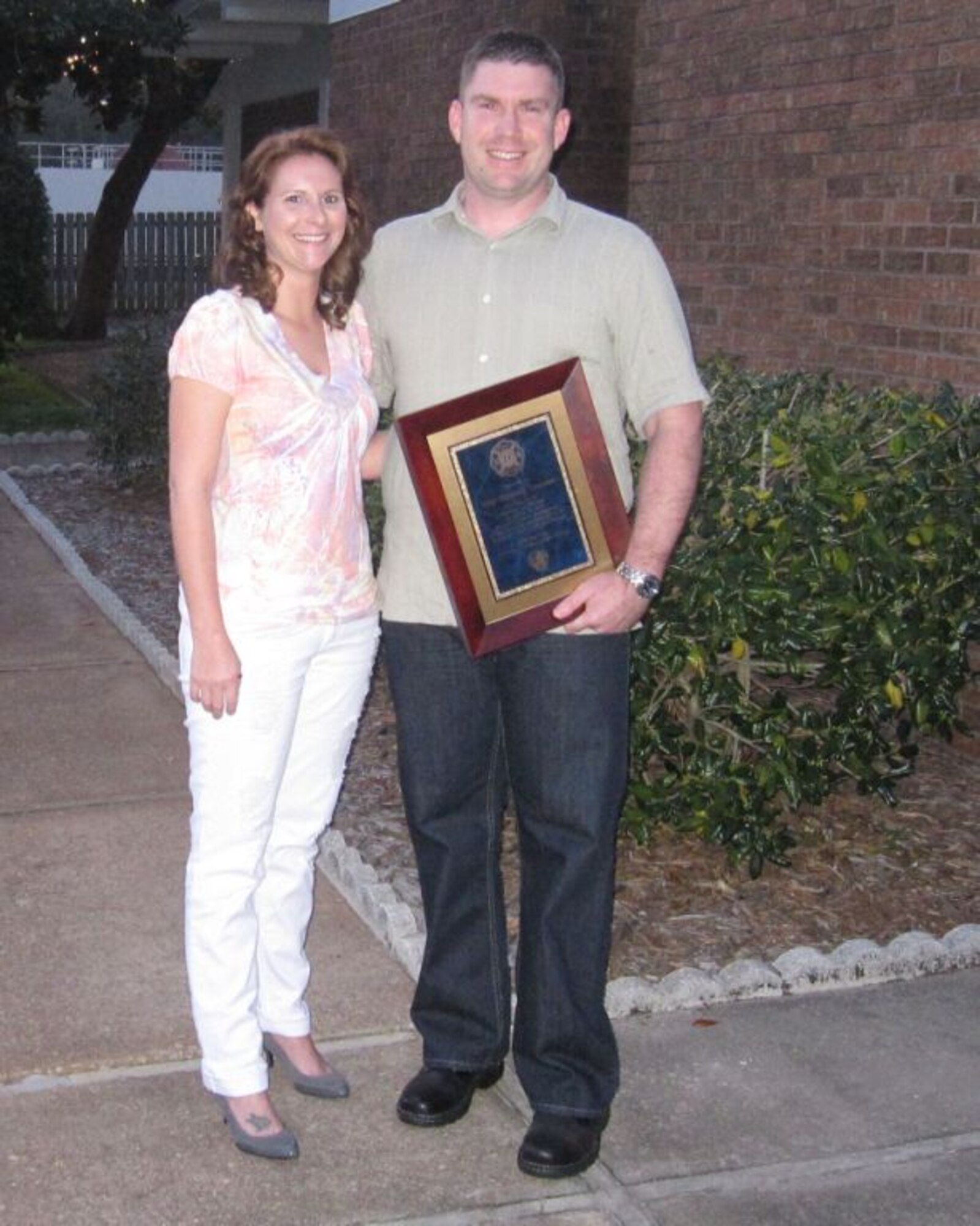 Tech. Sgt. Timothy Lemons, 623rd Air Operations Component, stands with wife, Amanda, March 29, after Sergeant Lemons' recognition ceremony.   
