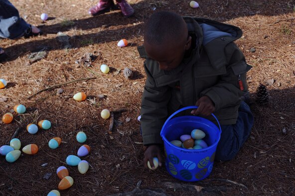 Aaron, 5, son of Ataya Wallace, 4th Fighter Wing command section superintendent, collects eggs during the base Easter egg hunt at Debden Park on Seymour Johnson Air Force Base, N.C., March 27, 2010. The egg hunt is one of many events hosted by the Airman & Family Readiness Center. Wallace is from Madisonville, Ky. (U.S. Air Force photo/Senior Airman Ciara Wymbs) 