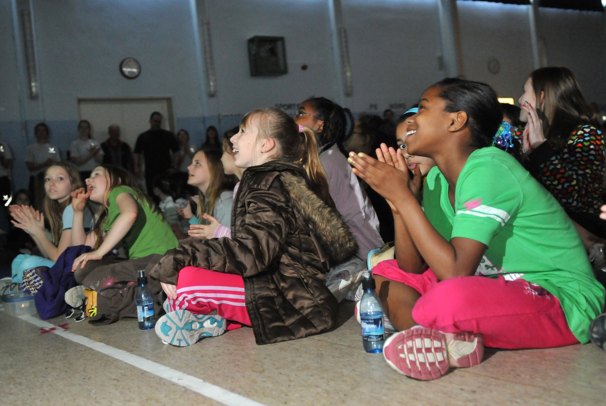 BITBURG ANNEX, Germany -- Students from Bitburg Middle School laugh at a video presented by Paul Staso, a world class ultra-marathon runner, during his visit March 25. Mr. Staso founded Promoting Active Children Everywhere Foundation and recently began running 500 miles across Germany visiting Department of Defense Dependents Schools along the way. (U.S. Air Force photo/Airman 1st Class Nick Wilson)