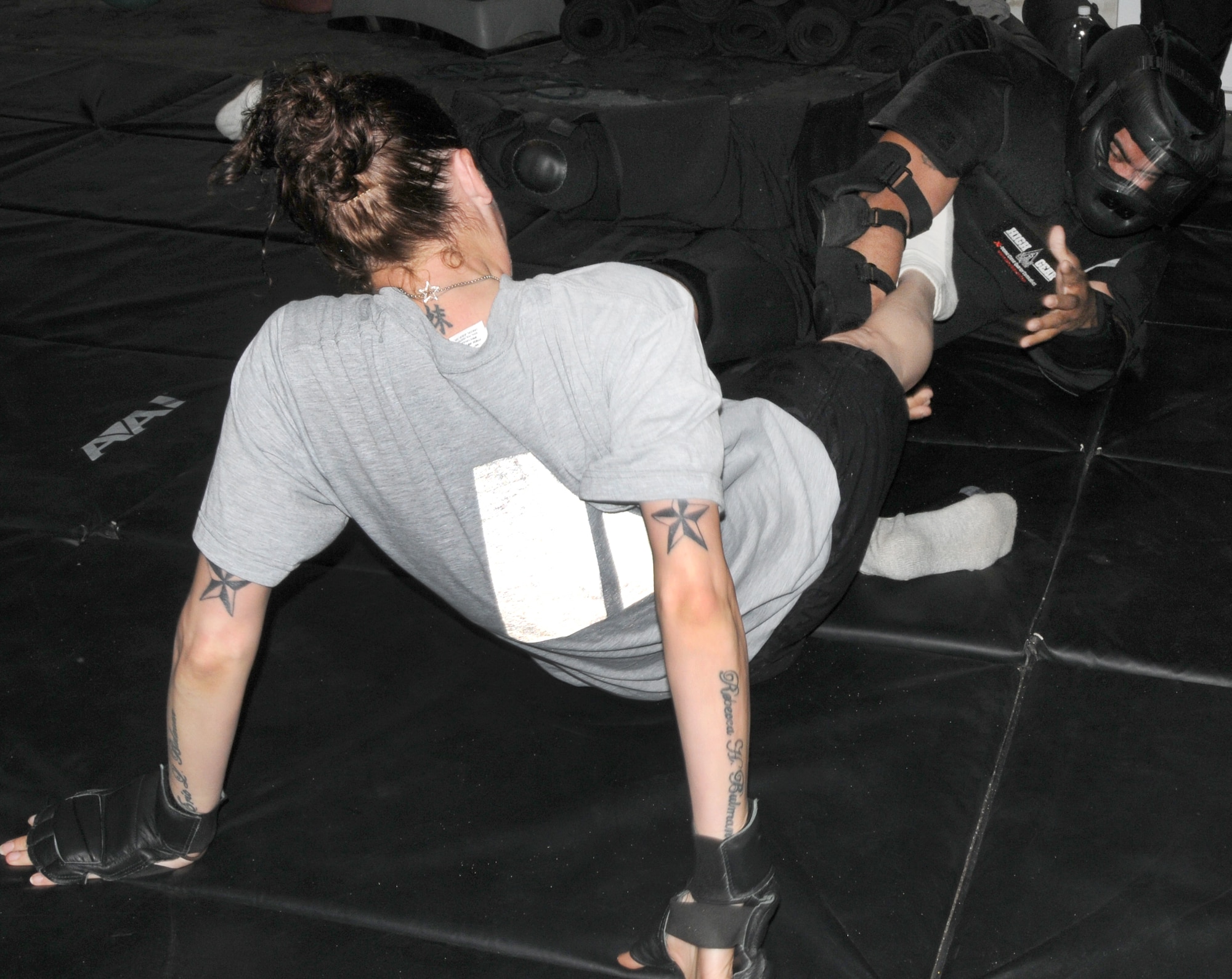 Participants in the Rape Aggression Defense course learn how to fend off an attack at Kirkuk Regional Air Base, Iraq, March 28, 2010.  U.S. Army Staff Sgt. Robert Lugo, a combatives instructor with the 501st HCC Brigade Support Battalion, deployed from Fort Bliss, Texas, teaches this course to keep women from falling prey to these types of attacks.  (U.S. Air Force photo/Senior Airman Mindy Bloem/Released)