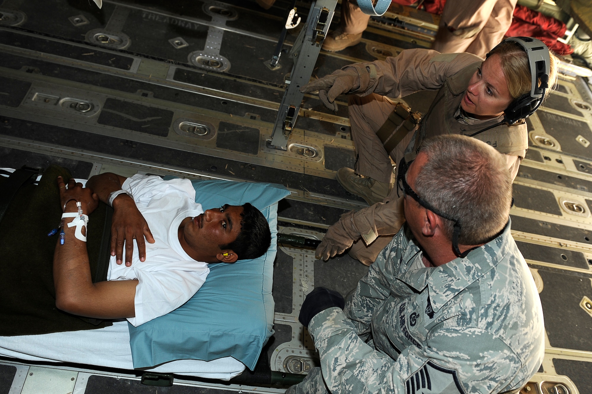 U.S. Air Force aeromedical Airmen load a wounded Afghan National Army soldier into a C-130 at Camp Bastion, Afghanistan, March 26, 2010. The 774th Expeditionary Airlift Squadron in Bagram flies C-130 aeromedical evacuations across Afghanistan. (U.S. Air Force photo by/ Tech. Sgt. Jeromy K. Cross/released)




