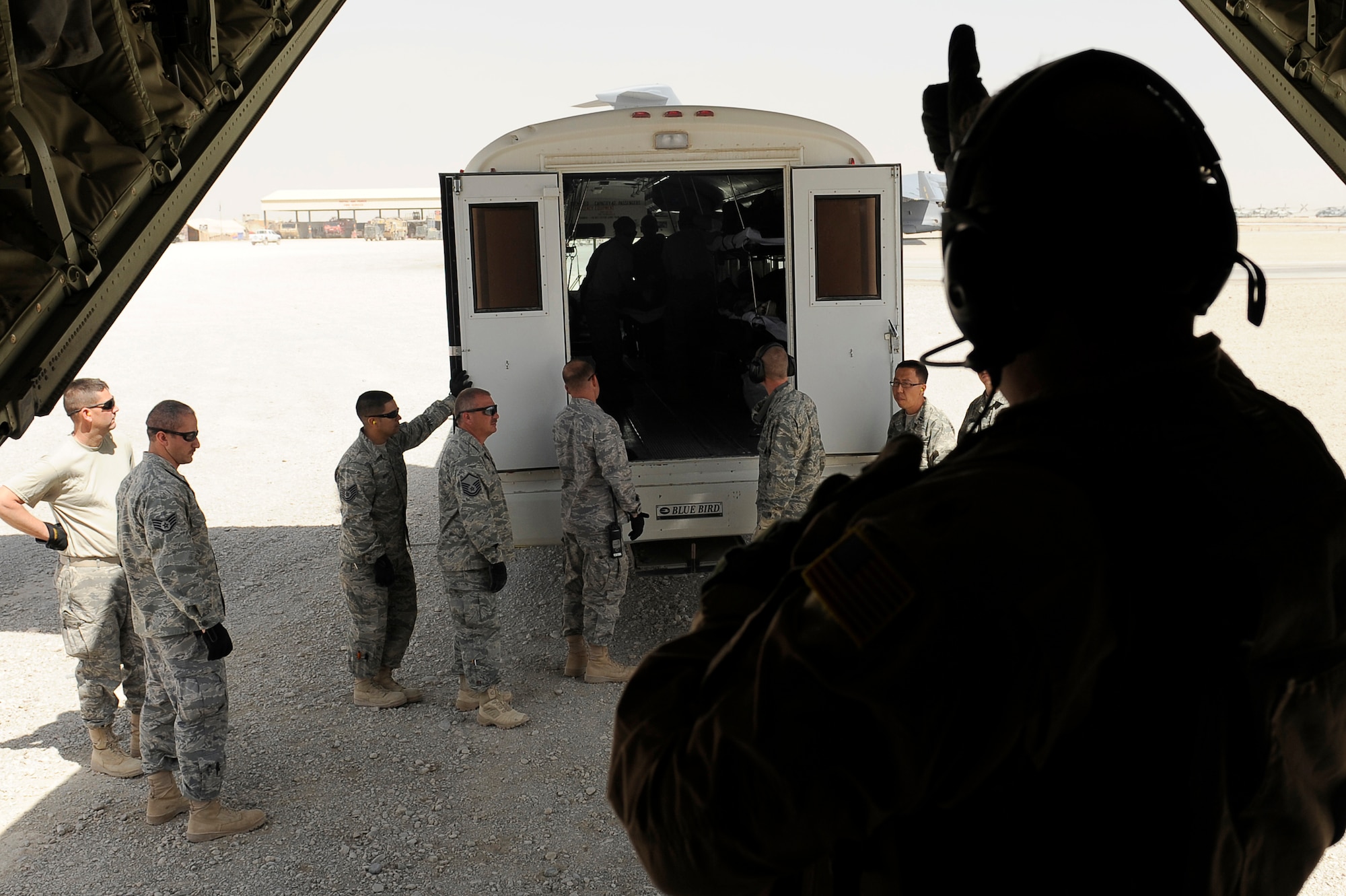 U.S. Air Force aeromedical Airmen take wounded personnel out of an ambulance and load them into a C-130 at Camp Bastion, Afghanistan, March 26, 2010. The 774th Expeditionary Airlift Squadron in Bagram flies C-130 aeromedical evacuations across Afghanistan. (U.S. Air Force photo by/ Tech. Sgt. Jeromy K. Cross/released)




