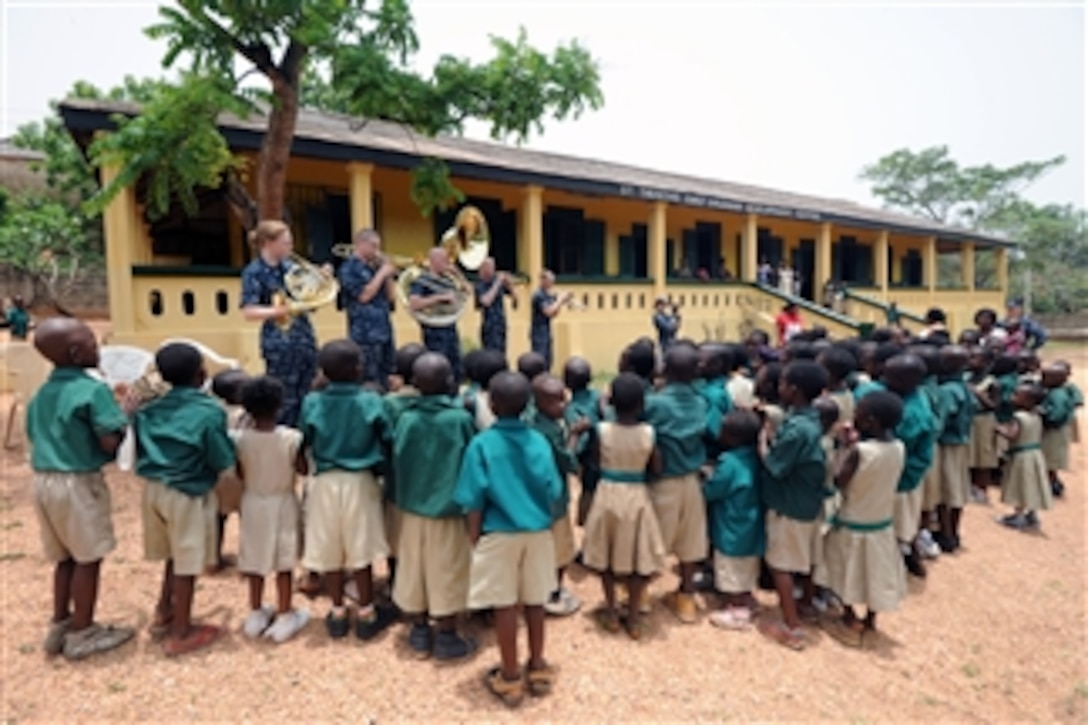 U.S. Navy sailors with Five Star Brass, the jazz quintet with the U.S. Naval Forces Europe Band, perform for children at the St. Theresa Early Childhood Centre in Takoradi, Ghana, on March 29, 2010.  The musicians were taking part in the dedication of a playground refurbished by the crew of the amphibious dock landing ship USS Gunston Hall (LSD 44).  The quintet is embarked aboard the Gunston Hall as part of Africa Partnership Station West, an international initiative developed by Naval Forces Europe and Naval Forces Africa that aims to improve maritime safety and security on the continent.  