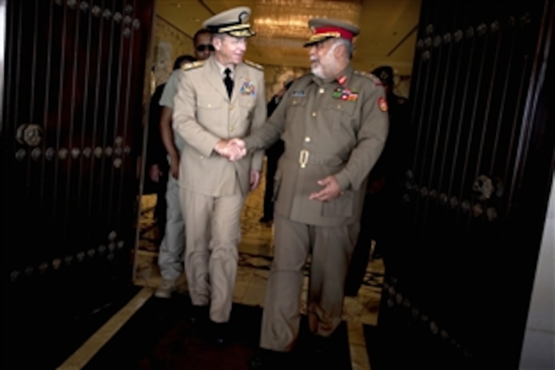 U.S. Navy Adm. Mike Mullen, chairman of the Joint Chiefs of Staff, thanks Lt. Gen. Ahmed al Khalid al Sabah, Chief of the General Staff of the Kuwaiti Army, after a counterpart meeting in Kuwait City, April 1, 2010.