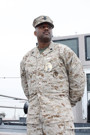 Petty Officer First Class Dwayne T. Jones, the first master in arms sailor to be permanently assigned to a Marine Corps Provost Marshal’s Office specifically for port and harbor security, looks out over the harbor toward the Pacific Ocean. As an expert in port and harbor security, Jones stands ready and prepared to take on the tasks ahead as joint security operations expand.