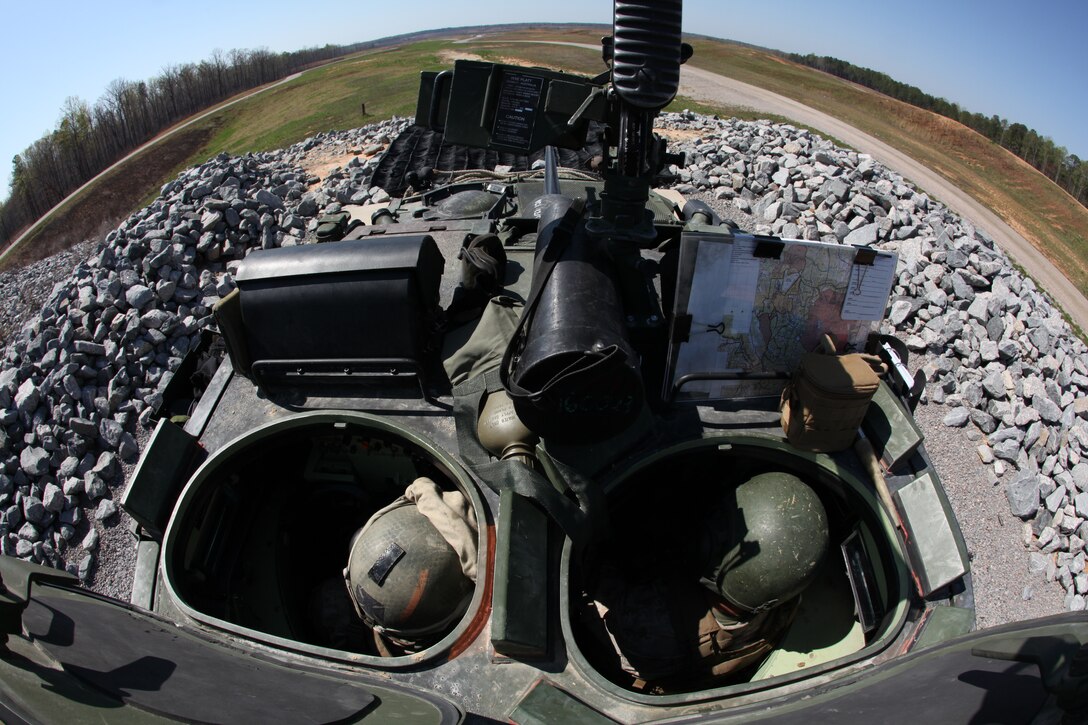 Lance Cpl. Heath M. Wynn and Cpl David M. Moreno, Light Armored Vehicle 25 gunners with Battalion Landing Team 3/8, prepare to calibrate their sights aboard Fort Pickett, Va., April 2, 2010. 26th MEU, consisting of Battalion Landing Team 3/8, Combat Logistics Battalion 26, and Marine Medium Tiltrotor Squadron 266, will spend the next six months training for its deployment. (Official United States Marine Corps Photo By Lance Corporal Tammy Hineline)::r::::n::::r::::n::