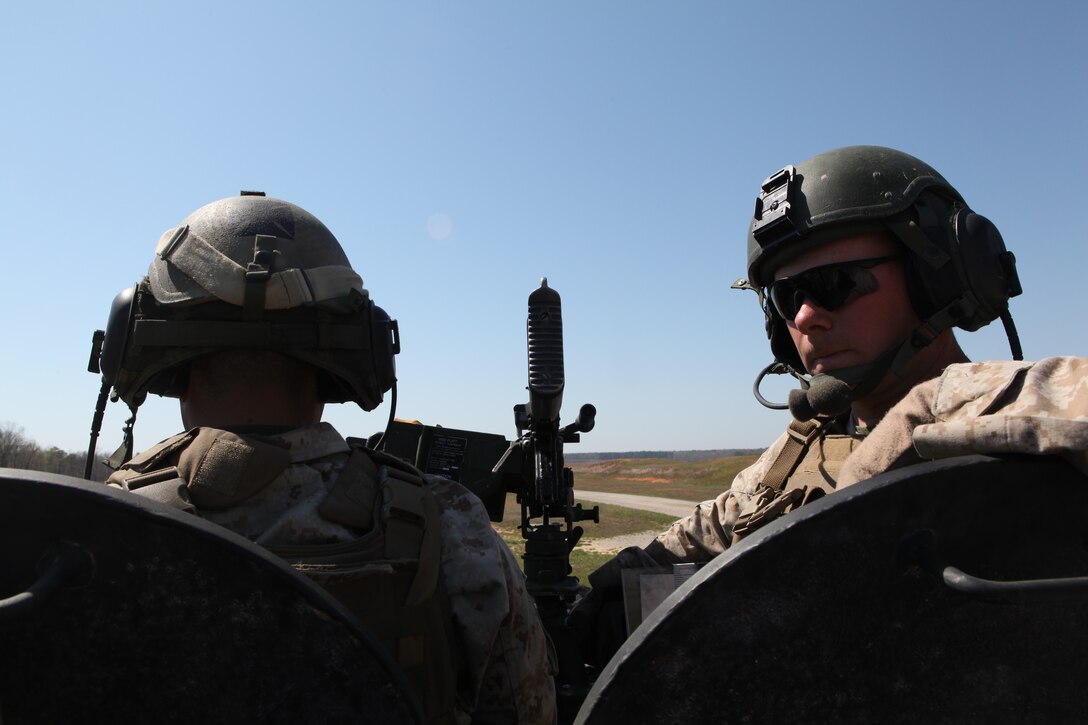 Lance Cpl. Heath M. Wynn and Cpl David M. Moreno, Light Armored Vehicle 25 gunners with Battalion Landing Team 3/8, prepare to calibrate their sights during a range exercise aboard Fort Pickett, Va., April 2, 2010. 26th MEU, consisting of Battalion Landing Team 3/8, Combat Logistics Battalion 26, and Marine Medium Tiltrotor Squadron 266, will spend the next six months training for its deployment. (Official United States Marine Corps Photo By Lance Corporal Tammy Hineline)::r::::n::