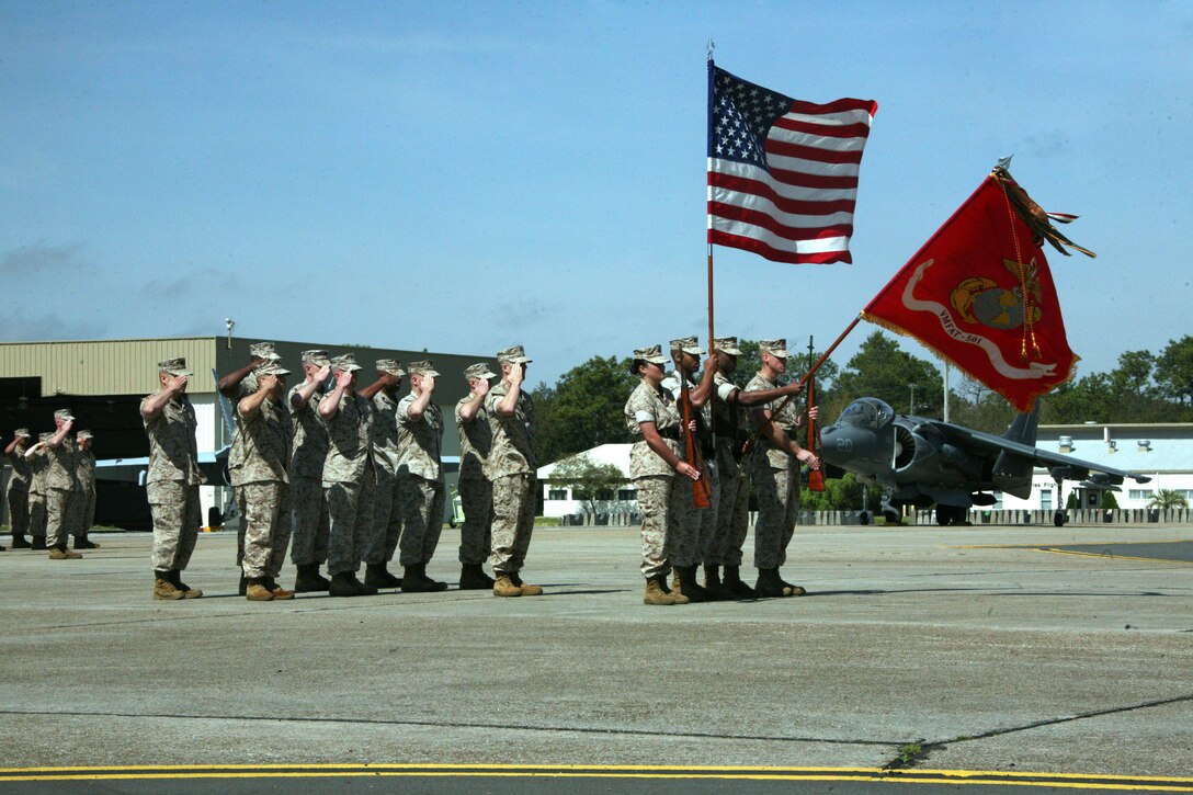 Marines of Marine Fighter Attack Training Squadron 501 salute the colors during the redesignation ceremony of Marine Fighter Attack Squadron 451 to VMFAT-501 at Eglin Air Force Base, Fla., April 2. VMFAT-501 is the first training squadron for the new Joint Strike Fighter.