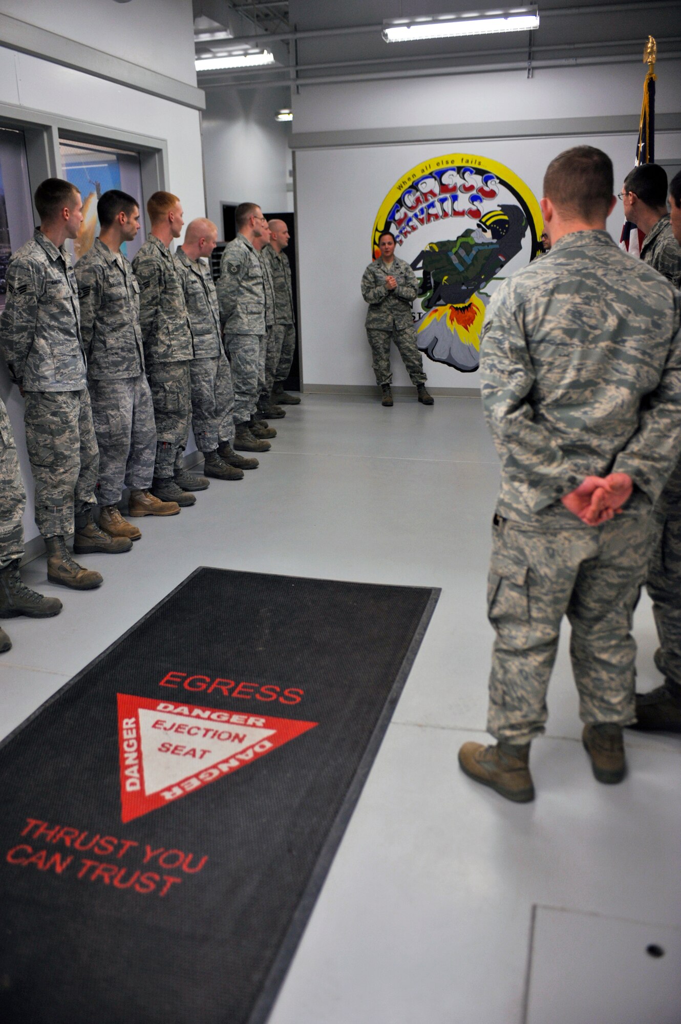 ELMENDORF AIR FORCE BASE, Alaska – Lt. Col. Diana Stuart, 3rd Component Maintenance Squadron commander, gathers with members from her 3rd CMS Egress Flight April 1, as she gets ready to recognize Airmen for promotion. Colonel Stuart recently won the 2009 Air Force Maintenance Effectiveness award for the small aircraft category. (Air Force photo by Airman 1st Class Christopher Gross)