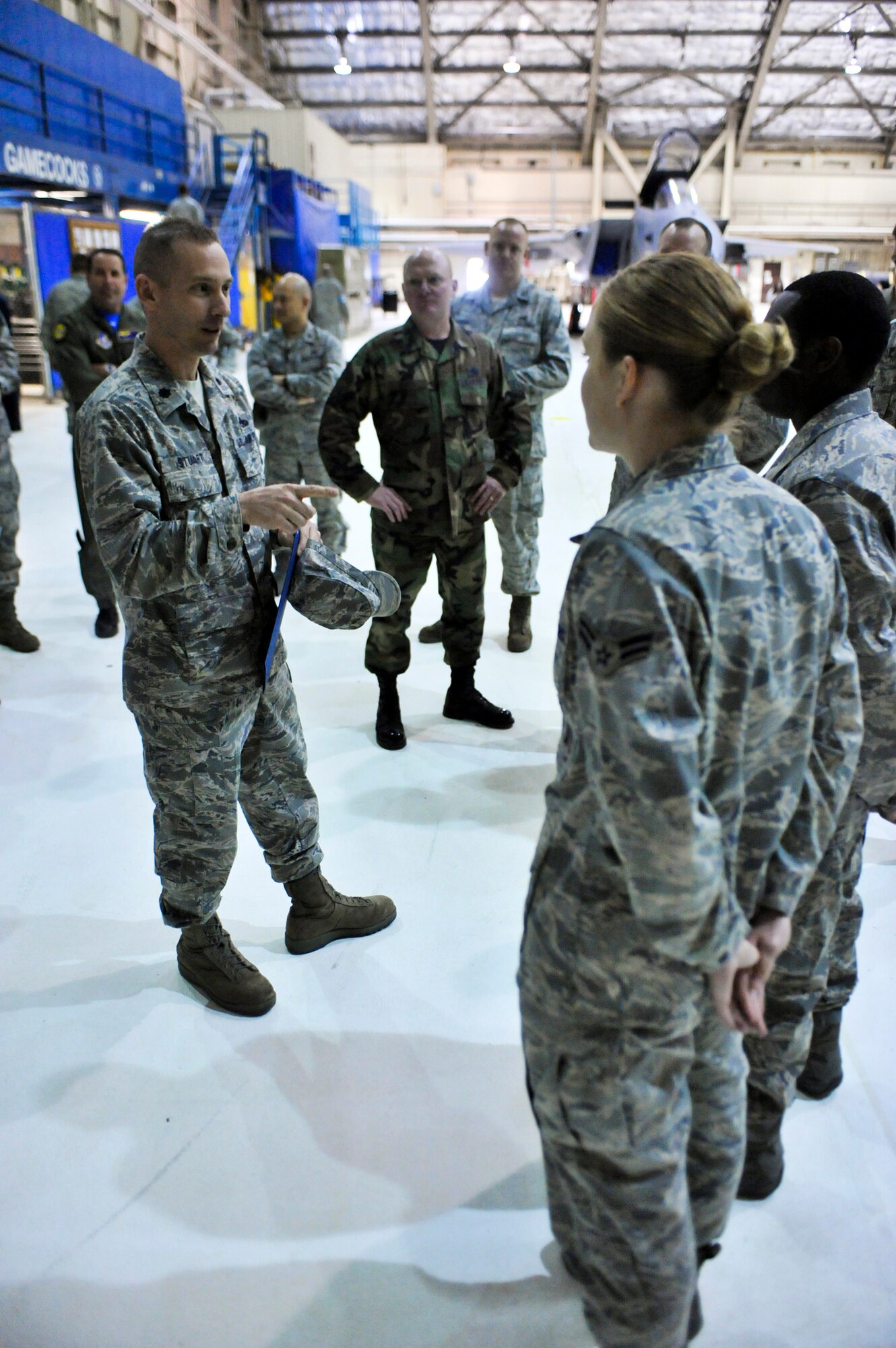ELMENDORF AIR FORCE BASE, Alaska – Lt. Col. Brian Stuart, 3rd Aircraft Maintenance Squadron commander, recognizes Airmen from the 3rd AMXS who have been selected for below-the-zone promotion April 2. Colonel Stuart was recently named runner up for the 2009 Air Force Maintenance Effectiveness award for the medium aircraft category. (Air Force photo by Airman 1st Class Christopher Gross)