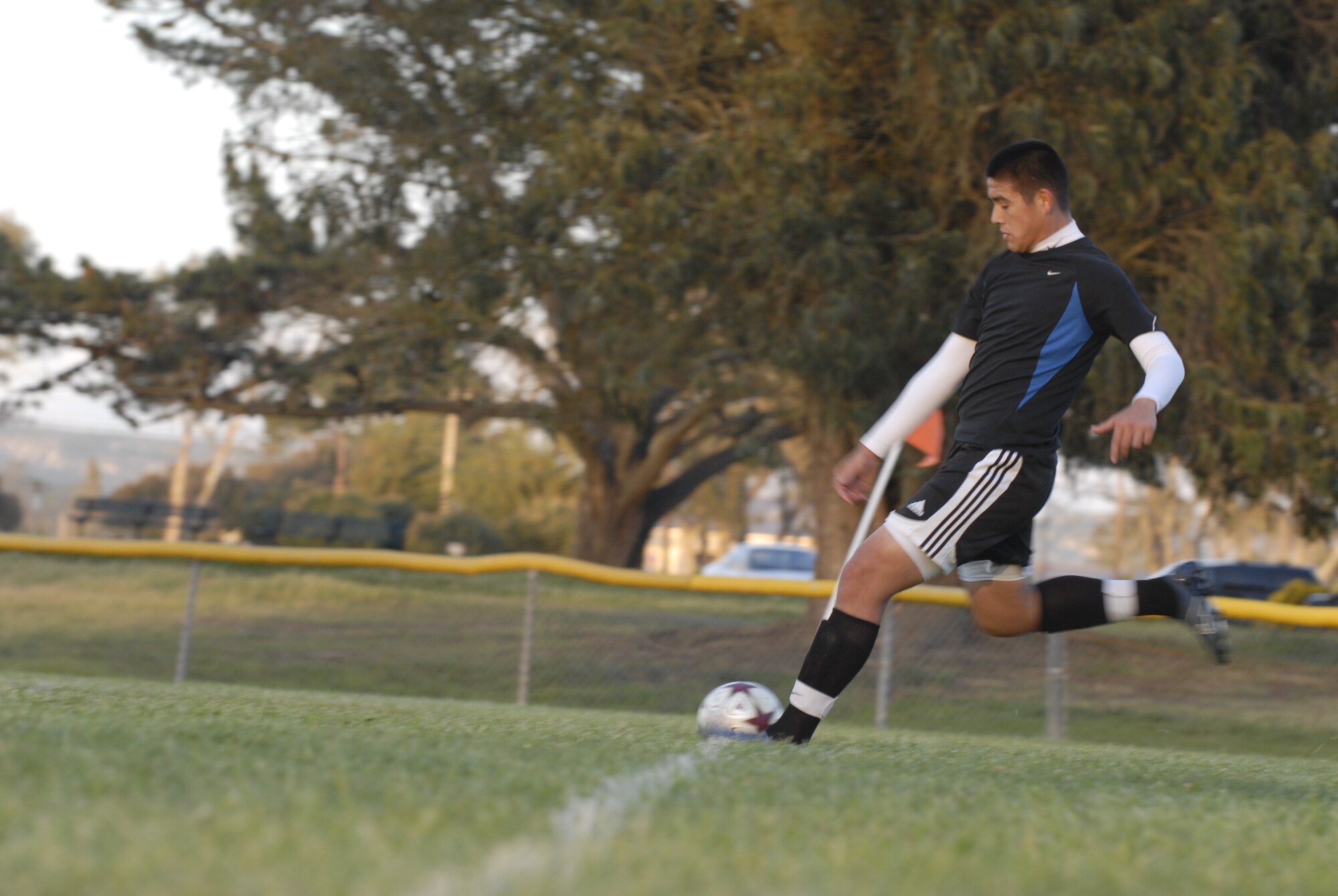 VANDENBERG AIR FORCE BASE, Calif. -- Giving it all he’s got, Edgar Franco, a 30th Security Forces Squadron soccer team member, kicks the ball into play here Thursday, April 1, 2010. The Vandenberg intramural soccer season begins on April 5. (U.S. Air Force photo/Senior Airman Ashley Reed)


