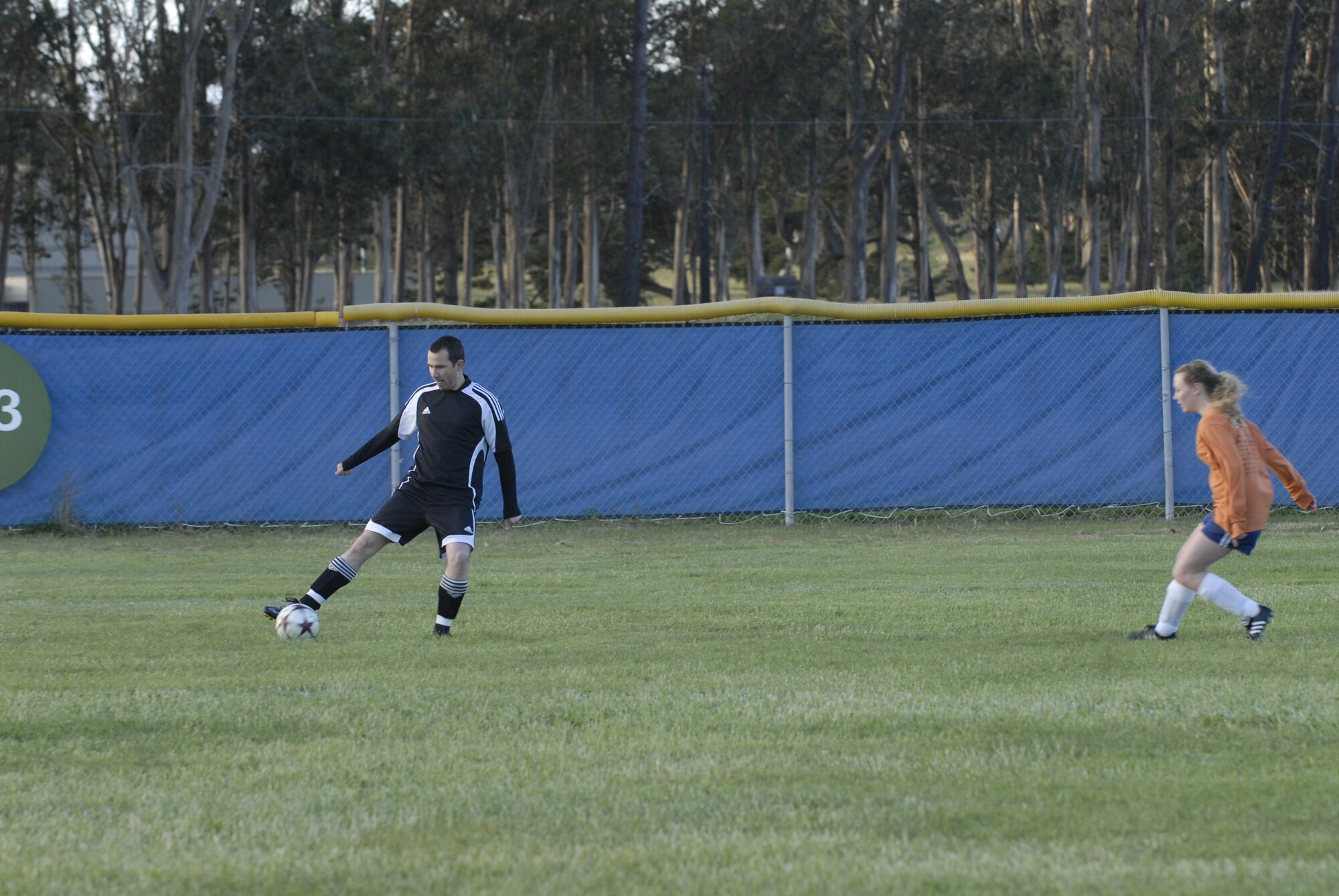 VANDENBERG AIR FORCE BASE, Calif. -- Jay Carter, a 30th Security Forces Squadron soccer team member, takes control of the ball during an intramural pre-season soccer game here Thursday, April 1, 2010. The Vandenberg intramural soccer season begins April 5. (U.S. Air Force photo/Senior Airman Ashley Reed)
