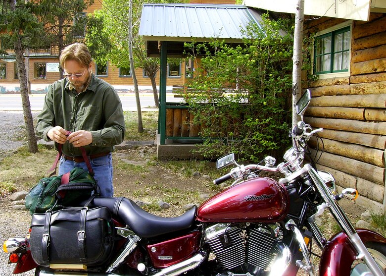 Michael Jago, 96th Civil Engineer Group, and his motorcycle prior to his motorcycle accident in February.  Mr. Jago hit a deer while riding his motorcycle on a Range Road near Eglin Air Force Base, Fla.  He sustained multiple injuries all over his body.  He attributes his survival on luck and wearing all of the necessary protective gear.  Courtesy photo.