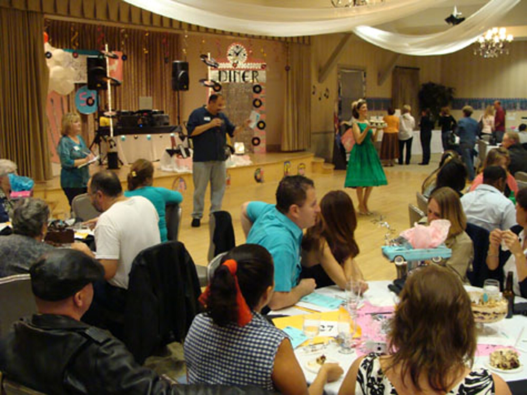 Tasty treats were up for bid at the Los Angeles Air Force Base Spouses Club Auction for Education at the Fort MacArthur Community Center, March 13.  This year’s event had a 1950’s theme and included a silent auction, dessert auction and sock hop.  The auction raised $17,000. Proceeds from the event benefit college scholarships for family members who are graduating from high school this year. The scholarships are scheduled to be awarded at a ceremony, May 13.  (Photo courtesy of the LAAFB Spouses Club)