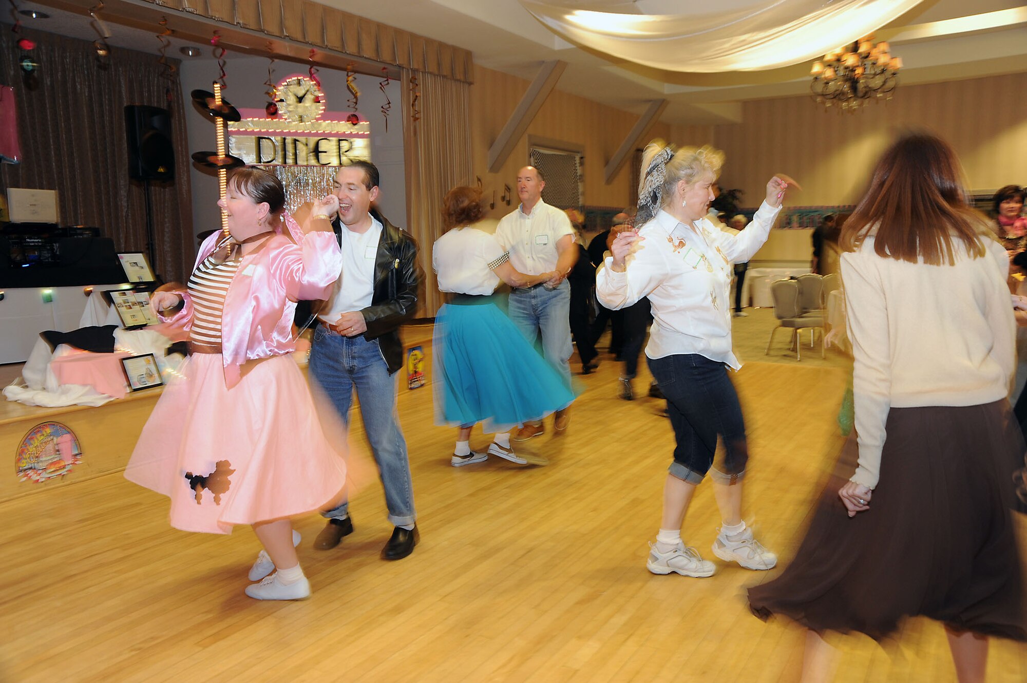 Dancers jive and swing at the Los Angeles Air Force Base Spouses Club Auction for Education at the Fort MacArthur Community Center, March 13.  This year’s event had a 1950’s theme and included a silent auction, dessert auction and sock hop.  The auction raised $17,000. Proceeds from the event benefit college scholarships for family members who are graduating from high school this year. The scholarships are scheduled to be awarded at a ceremony, May 13.  (Photo by Joe Juarez)