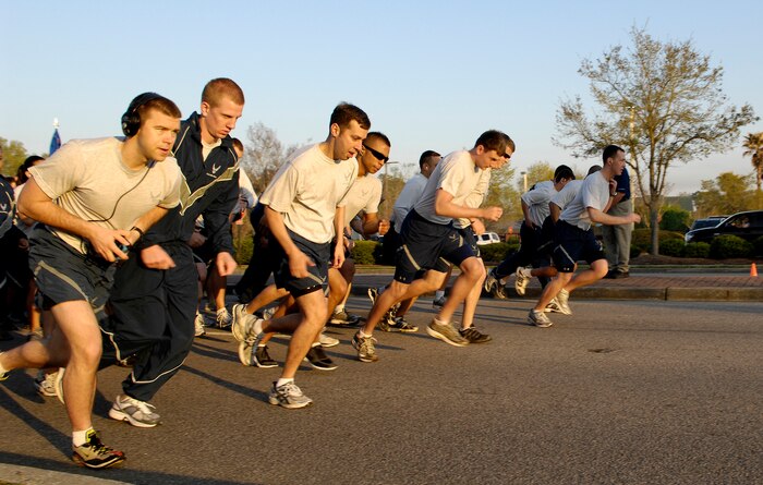 Airmen dash off as the horn sounds at the beginning of the Commander's Fitness Challenge on Joint Base Charleston, S.C., April 2, 2010. This month's run was dedicated to sexual assault awareness and informing Airmen of the overwhelming statistics about rape and abuse. (U.S. Air Force Photo/Airman 1st Class Lauren Main)