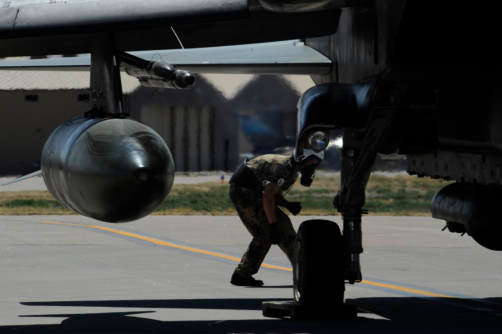 HOLLOMAN AIR FORCE BASE, N.M. -- Staff Sgt. Rico Waclawski, First Line Maintainer for the German Air Force Flying Training Center, inspects the front and back of a Tornado, March 29, 2010, before take-off. First Line Maintainers perform ?before take-off inspection? to check for tires and leaks, and to ensure all electronic devices working properly.  After the inspection is complete, the safety handles on the training bombs are armed and the pilots prepare for take-off. (U.S. Air Force photo by Airman 1st Class Veronica Stamps) (Released)