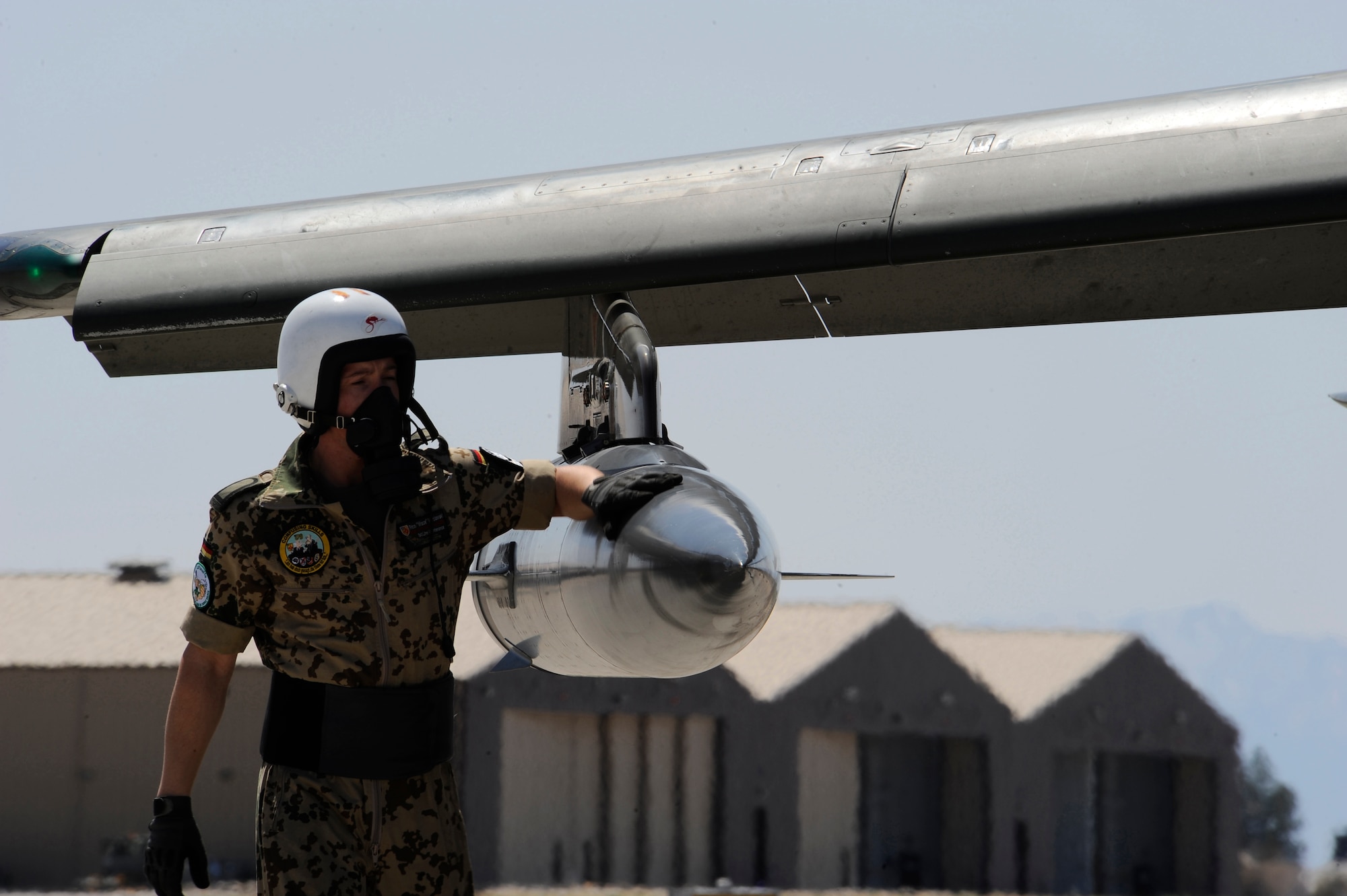 HOLLOMAN AIR FORCE BASE, N.M. -- Staff Sgt. Rico Waclawski, First Line Maintainer for the German Air Force Flying Training Center, inspects the chaff flare dispencer of a Tornado, March 29, 2010, before take-off. First Line Maintainers perform ?before take-off inspection? to check for tires and leaks, and to ensure all electronic devices are working properly.  After the inspection is complete, the safety handles on the training bombs are armed and the pilots prepare for take-off. (U.S. Air Force photo by Airman 1st Class Veronica Stamps) (Released) 