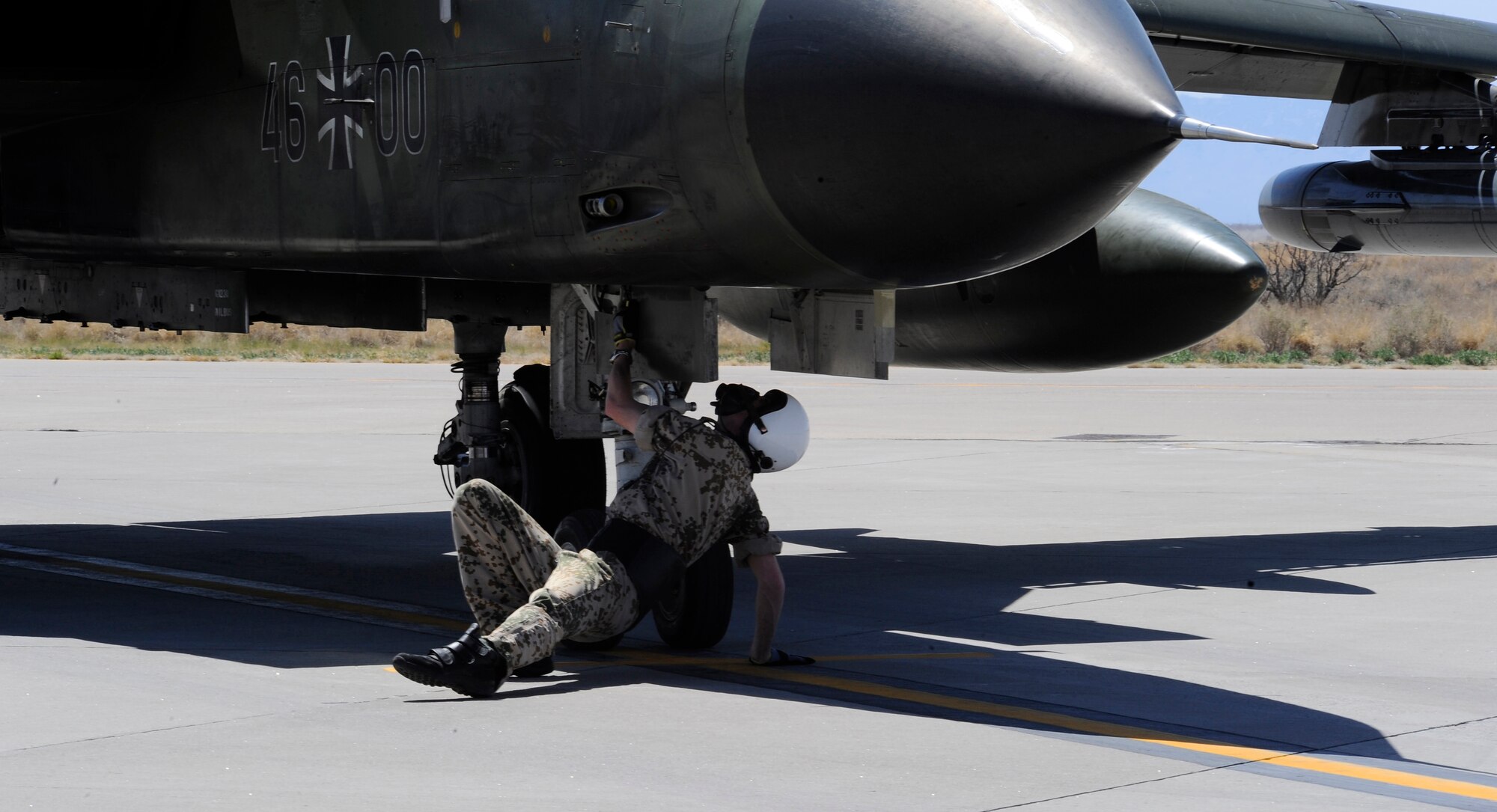 HOLLOMAN AIR FORCE BASE, N.M. -- Staff Sgt. Kai Hartkopf, First Line Maintainer for the German Air Force Flying Training Center, inspects the radar system of a Tornado, March 29, 2010, before take-off. First Line Maintainers perform ?before take-off inspection? to check for tires and leaks, and to ensure all electronic devices are working properly.  After the inspection is complete, the safety handles on the training bombs are armed and the pilots prepare for take-off. (U.S. Air Force photo by Airman 1st Class Veronica Stamps) (Released)