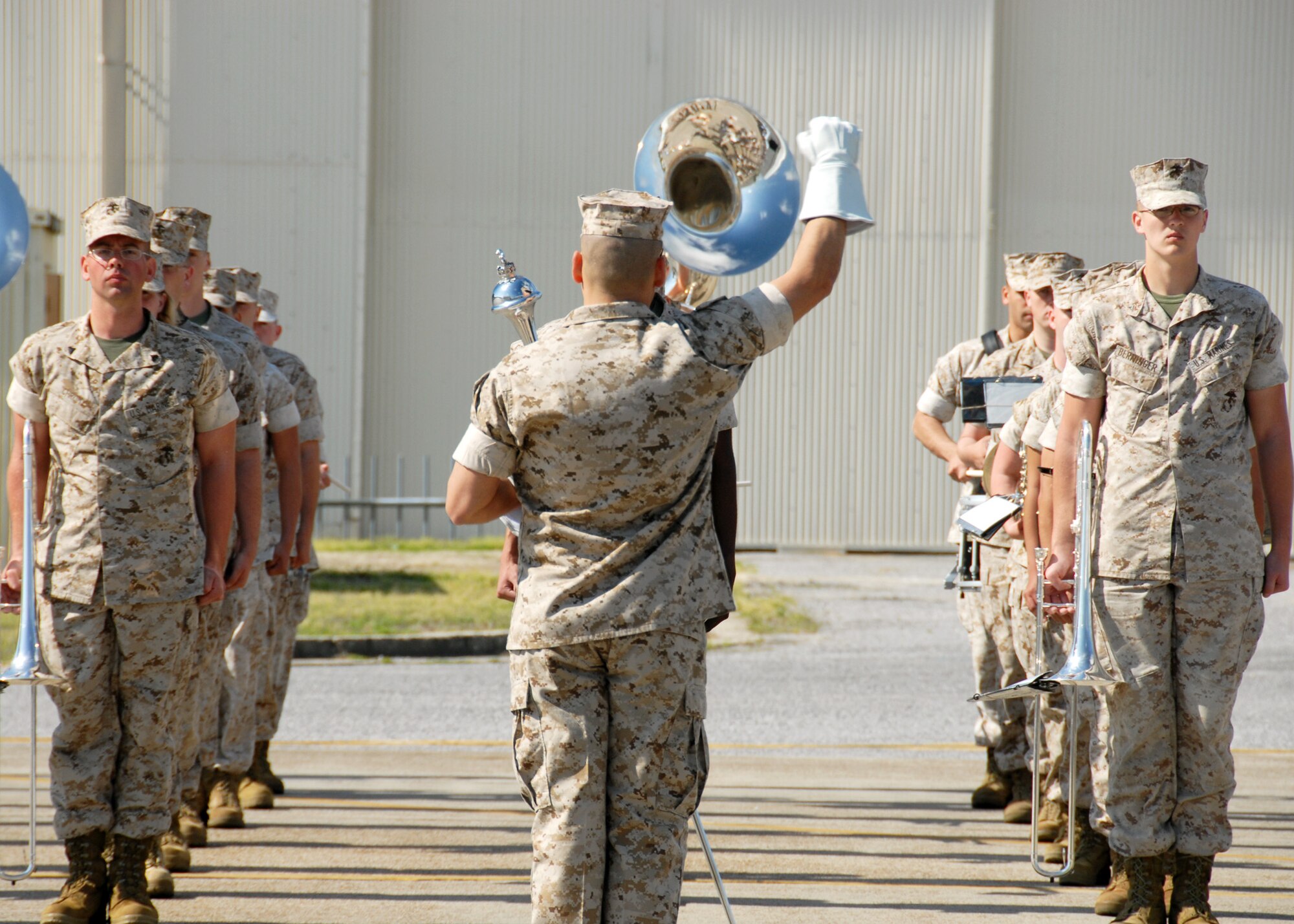 Drum Major Gunnery Sgt. Victor Miranda, leads the 2nd Marine Aircraft Wing Band during the Marine Fighter Attack Training Squadron 501 stand-up ceremony April 2 at Eglin Air Force Base, Fla. The 501st becomes the first Marine JSF squadron and also the first Marine squadron embedded into a Air Force Wing. Maj. Gen. James F. Flock, 2nd Marine Aircraft Wing commander, called the occasion "the next chapter in the future of Marine aviation." The band came from Cherry Point, N.C. to perform at the ceremony. (U.S. Air Force photo/Samuel King Jr.)