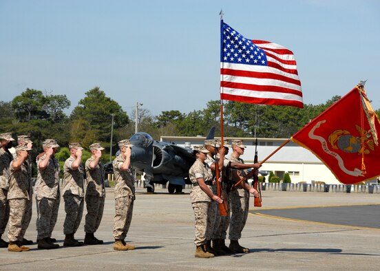 Squadron staff members salute during the playing of the National Anthem as part of the Marine Fighter Attack Training Squadron 501 stand-up ceremony April 2 at Eglin Air Force Base, Fla. The band came from Cherry Point, N.C., to perform at the ceremony. (U.S. Air Force photo/Samuel King Jr.) 
