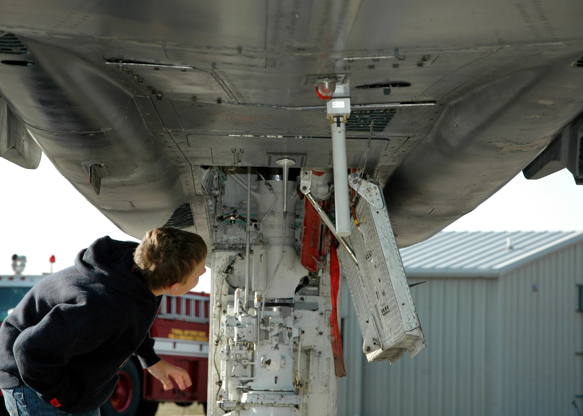 A child from the Taunton Family Children’s Home examines an F-4 Phantom on “Death Row.”  The children learned about the aircraft used as full-scale drones and their mission in the 53rd Weapons Evaluation Group. The group toured Tyndall AFB March 26 during their spring break to see the Air Force in action. (U.S. Air Force photo/ Ashley M. Wright)  