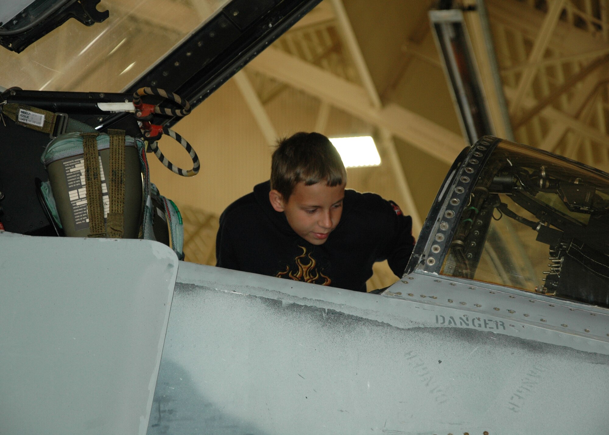 A child from the Taunton Family Children’s Home examines an F-4 Phantom used in heritage flights. The group toured Tyndall AFB March 26 during their spring break to see the Air Force in action. (U.S. Air Force photo/ Ashley M. Wright)