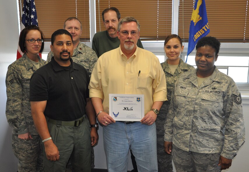 LAUGHLIN AIR FORCE BASE, Texas – James Brown, 47th Logistics Readiness Division, poses with fellow members of his division after being presented the XLer of the Week award by Col. David Ellis, 47th Flying Training Wing vice commander, March 31. (U.S. Air Force photo by Airman 1st Class Blake Mize)