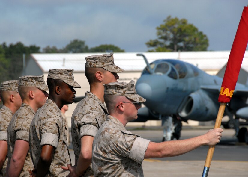 A formation of Marines stand at parade-rest prior to the Marine Fighter Attack Training Squadron 501 stand-up ceremony April 2 at Eglin Air Force Base, Fla. The 501st becomes the first Marine JSF squadron and also the first Marine squadron embedded into a Air Force Wing. Maj. Gen. James F. Flock, 2nd Marine Aircraft Wing commander, called the occasion "the next chapter in the future of Marine aviation." (U.S. Air Force photo/Samuel King Jr.)