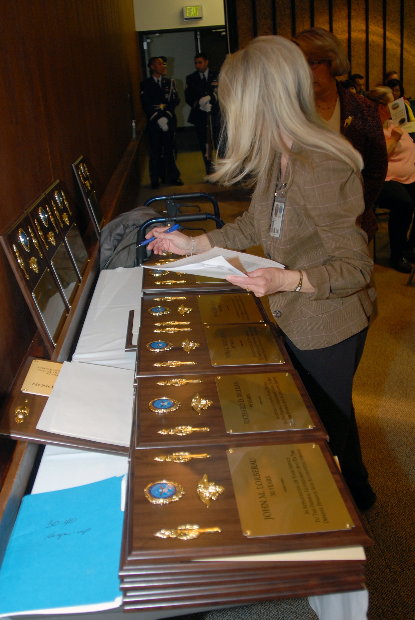 Retirement plaques are readied for a group retirement ceremony for Defense Finance and Accounting Service Denver employees March 11. After more than 33 years at the Buckely Annex, DFAS Denver closed March 31 as a result of a 2005 Base Realignment and Closure decision. (U.S. Air Force photo/Dwayne Beuthel)