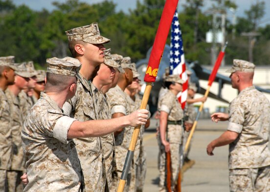 A formation of Marines listen to instruction prior to the Marine Fighter Attack Training Squadron 501 stand-up April 2 at Eglin Air Force Base, Fla.  The 501st becomes the first Marine JSF squadron and also the first Marine squadron embedded into a Air Force Wing. Maj. Gen. James F. Flock, 2nd Marine Aircraft Wing commander, called the occasion "the next chapter in the future of Marine aviation."  (U.S. Air Force photo/Samuel King Jr.)