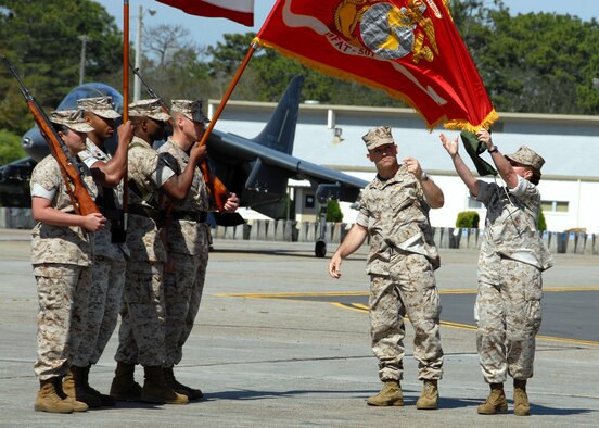 Lt. Col. James Wellons and Sgt. Maj. Bonnie Skinner, Marine Fighter Attack Training Squadron 501 commander and sergeant major, unfurl the new flag officially redesignating the squadron. The 501st becomes the first Marine JSF squadron and also the first Marine squadron embedded into an Air Force wing. Maj. Gen. James F. Flock, 2nd Marine Aircraft Wing commander, called the occasion "the next chapter in the future of Marine aviation." (U.S. Air Force photo/Samuel King Jr.) 