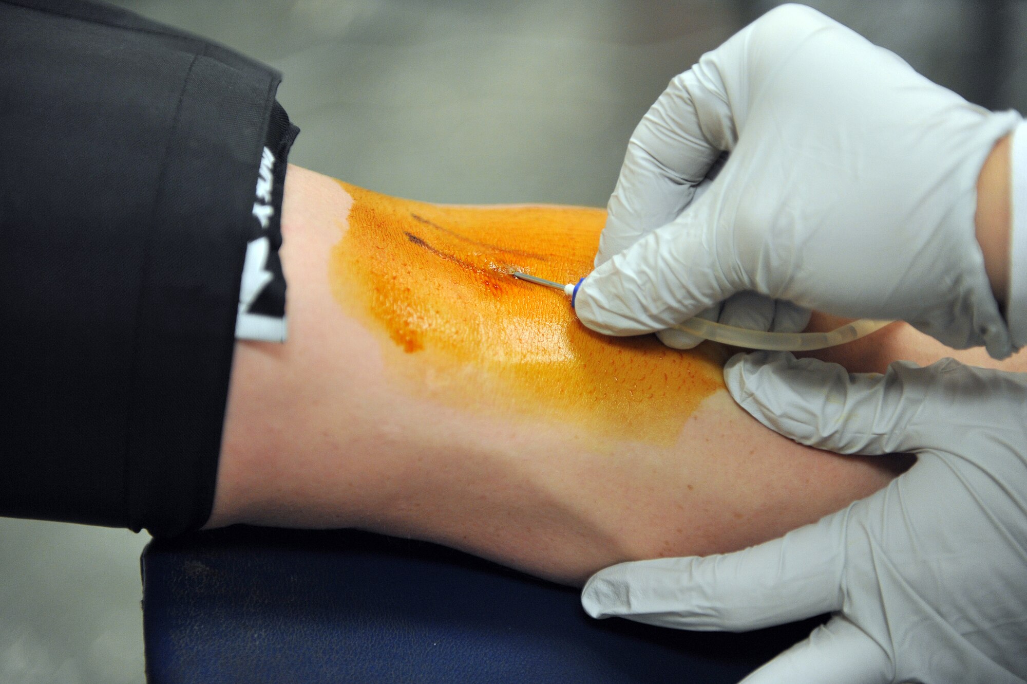 An American Red Cross blood collection technician prepares to draw blood from a donor during an ARC blood drive at the base chapel here April 2. According to the ARC website, every two seconds someone in the U.S. needs blood. (U.S. Air Force photo by Staff Sgt. Andrea Thacker/Released)