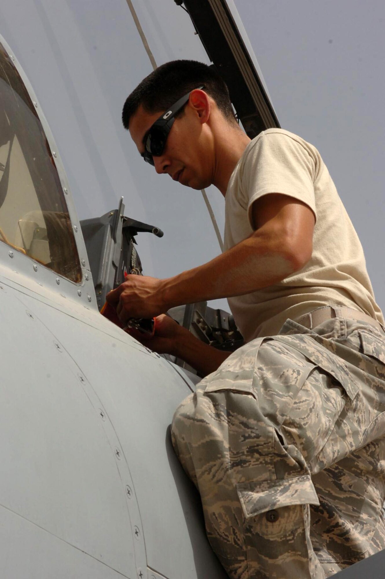 Senior Airman Stephen Boggs, a crew chief on an A-10C Thunderbolt II from the 188th Fighter Wing of the Arkansas Air National Guard, prepares the cockpit for the pilot during preflight checks March 21, 2010, at Kandahar Airfield, Afghanistan. Boggs and more than 250 members of the 188th are currently deployed to Kandahar Airfield, Afghanistan as part of an Air Expeditionary Force rotation. The unit is scheduled to return home in May. (Photo by Lt. Col. Keith Moore/ Arkansas Air National Guard Public Affairs).