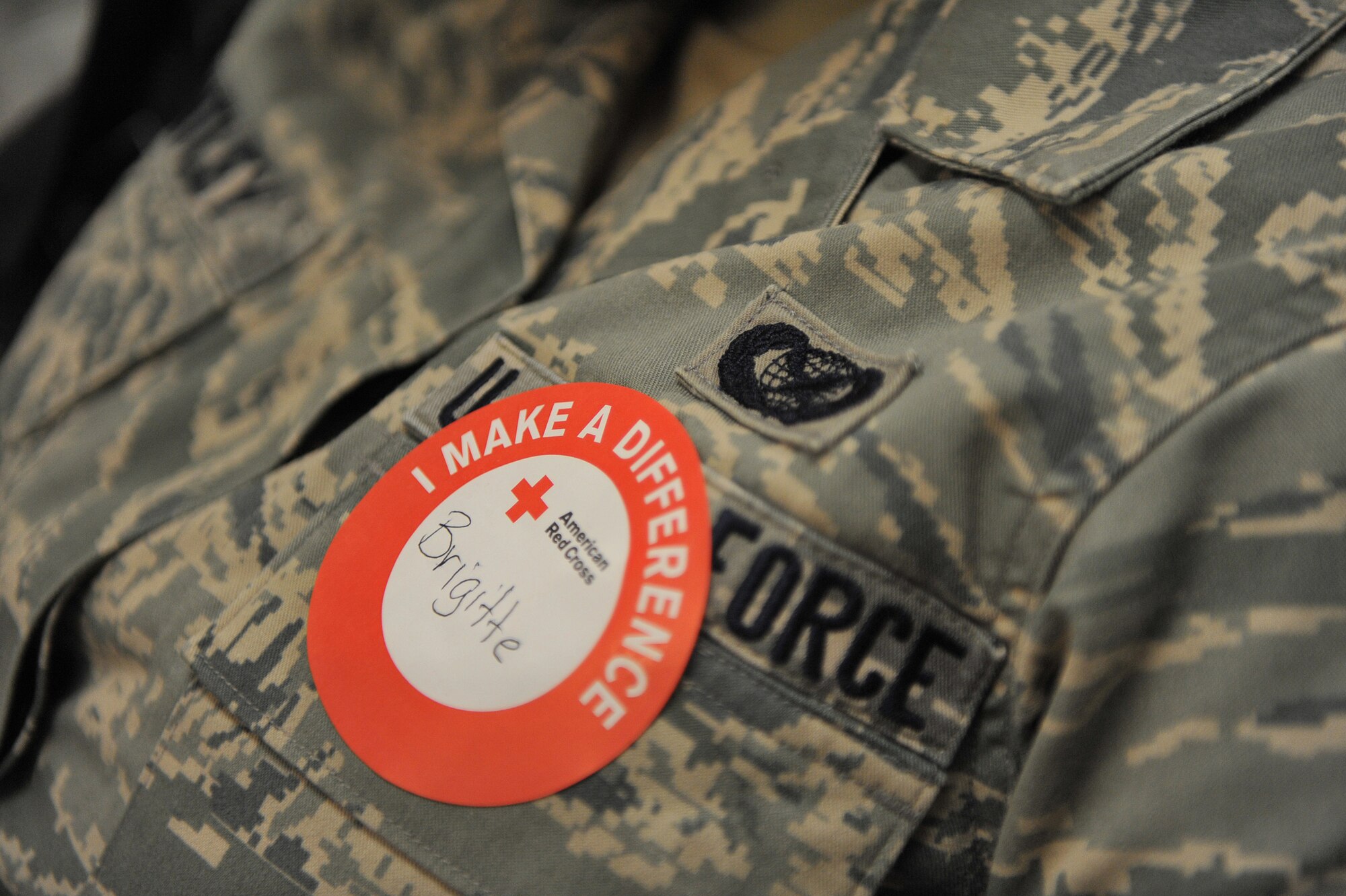 Airman 1st Class Brigitte Brantley, 23rd Wing Public Affairs, wears her donation sticker after donating blood at the base chapel here April 2. Each blood donation can help as many as three people. (U.S. Air Force photo by Staff Sgt. Andrea Thacker/Released)